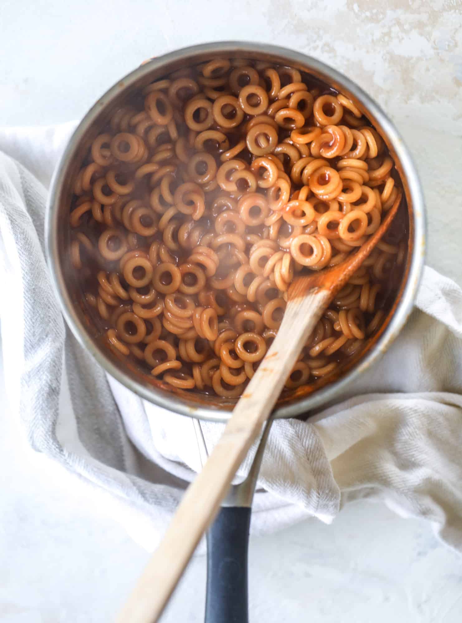These homemade spaghettios are the ultimate comfort food! They come together in less than 30 minutes, are super easy and flavorful and topped with crispy crunchy manchego cheese that takes the taste over the top! I howsweeteats.com #homemade #spaghettios