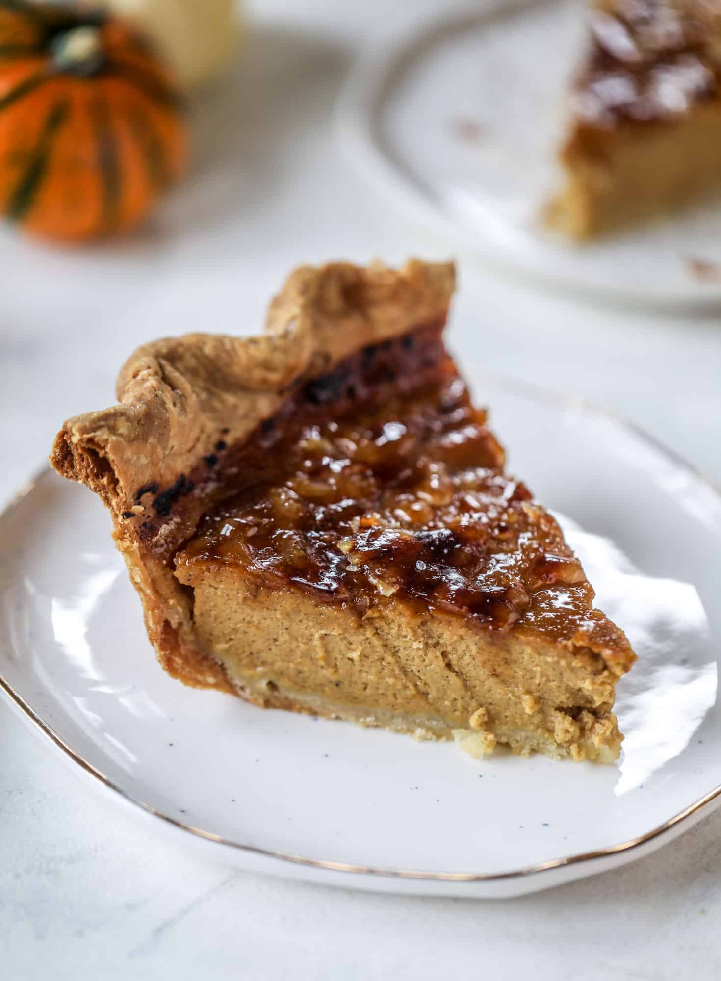 This brûlée pumpkin pie is the best of both worlds in pumpkin desserts! A delicious flaky crust, a creamy pumpkin filling and a crunchy, crispy topping - brûléed sugar right before serving. It's a whole new way to serve pumpkin pie! I howsweeteats.com #pumpkinpie #brulee