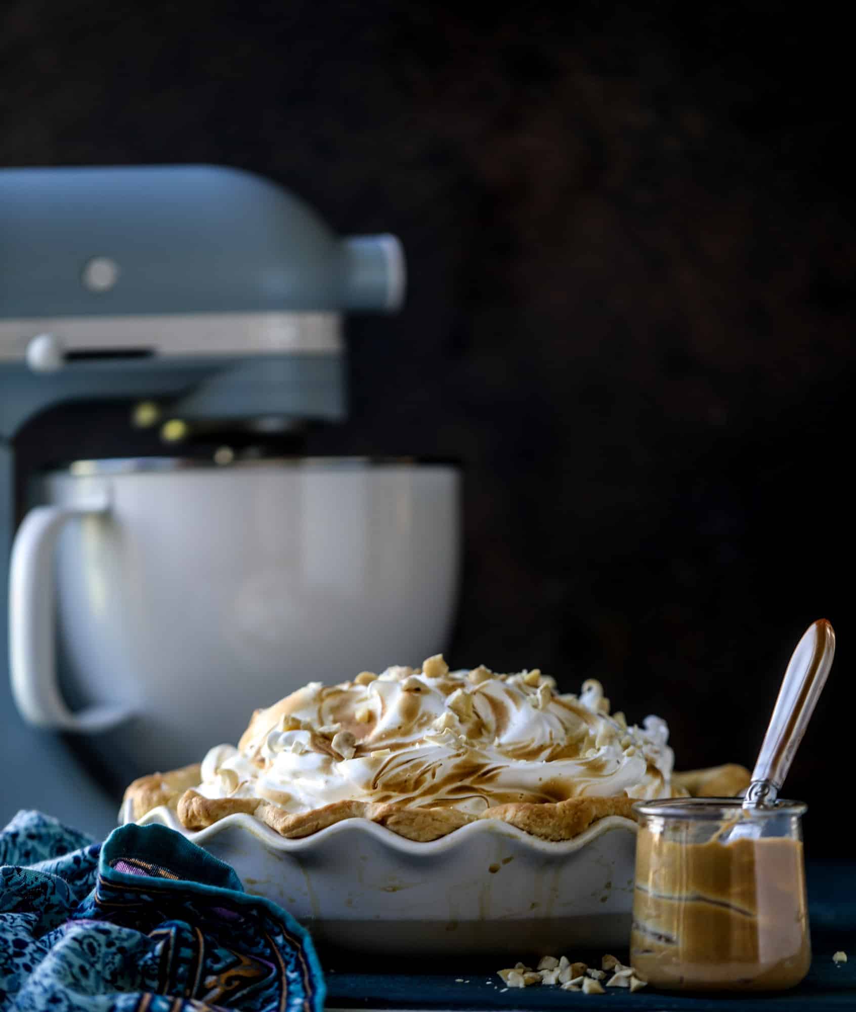 This peanut butter pie recipe is almost identical to the one that my grandmother made when I was a crust. Flaky pastry crust is what makes this pie different, along with a creamy no-bake peanut butter filling that is rich and decadent! I howsweeteats.com #peanutbutter #pie
