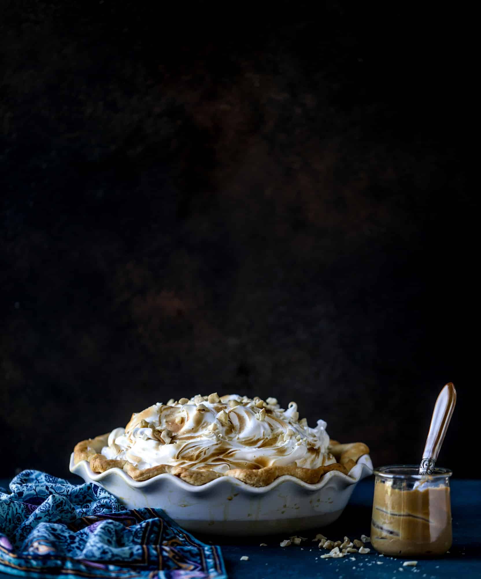 This peanut butter pie recipe is almost identical to the one that my grandmother made when I was a crust. Flaky pastry crust is what makes this pie different, along with a creamy no-bake peanut butter filling that is rich and decadent! I howsweeteats.com #peanutbutter #pie