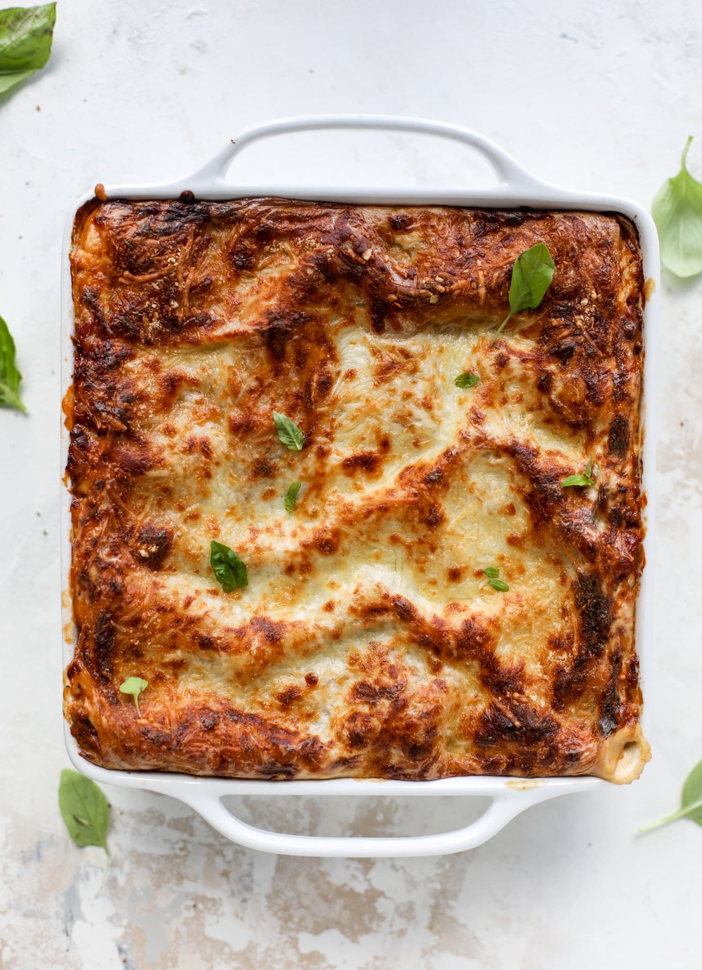 This lasagna bolognese is the ultimate comfort food. Meaty sauce, whole wheat lasagna noodles, creamy bechamel and grated cheese come together to create the most perfect slice of lasagna heaven! I howsweeteats.com #lasagna #bolognese