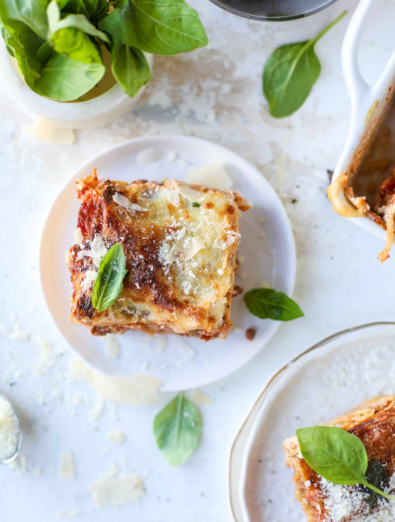 This lasagna bolognese is the ultimate comfort food. Meaty sauce, whole wheat lasagna noodles, creamy bechamel and grated cheese come together to create the most perfect slice of lasagna heaven! I howsweeteats.com #lasagna #bolognese