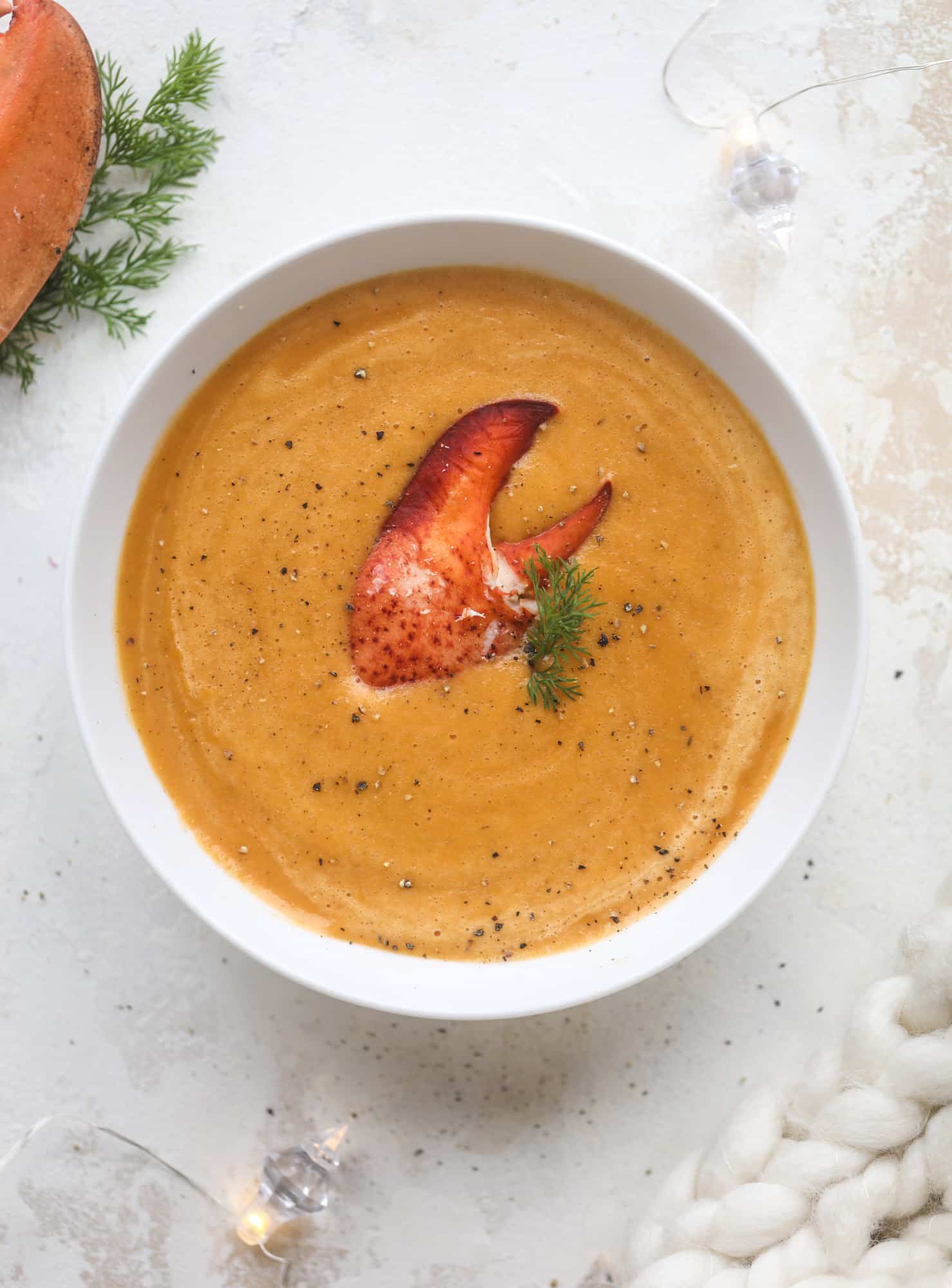 This lobster bisque recipe is delicious, easy and always a crowd pleaser! It's so simple to make at home and it's a rich, decadent treat to serve your family. I also show you how to make a lobster cappuccino, which is lobster bisque with foamed cream! I howsweeteats.com #lobster #bisque