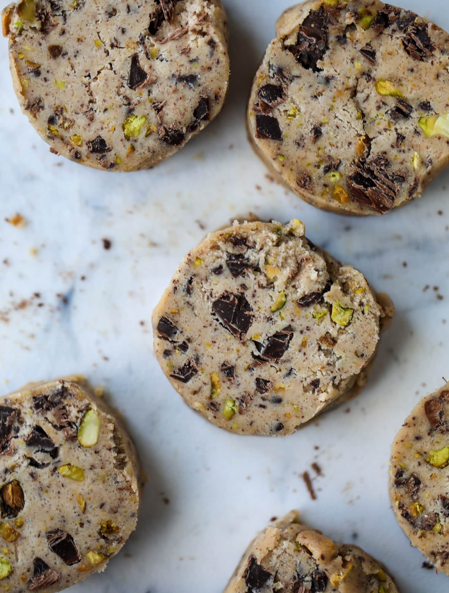 This chocolate pistachio shortbread recipe is the perfect combo of sweet and salty in a crunchy cookie! Melty, rich dark chocolate comes together with roasted, salted pistachios to make a delicious crunchy cookie! I howsweeteats.com #chocolate #pistachio #shortbread