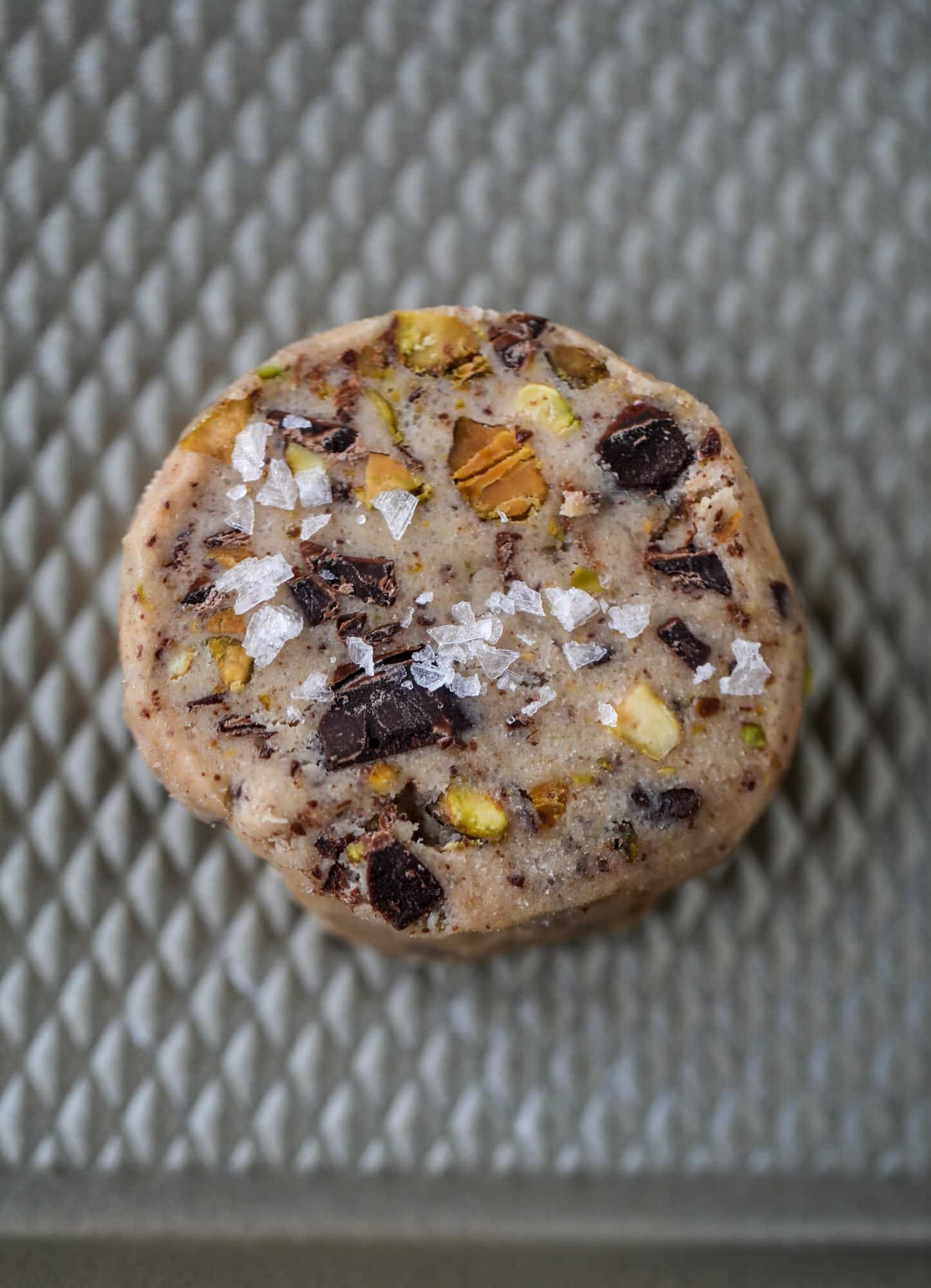 This chocolate pistachio shortbread recipe is the perfect combo of sweet and salty in a crunchy cookie! Melty, rich dark chocolate comes together with roasted, salted pistachios to make a delicious crunchy cookie! I howsweeteats.com #chocolate #pistachio #shortbread