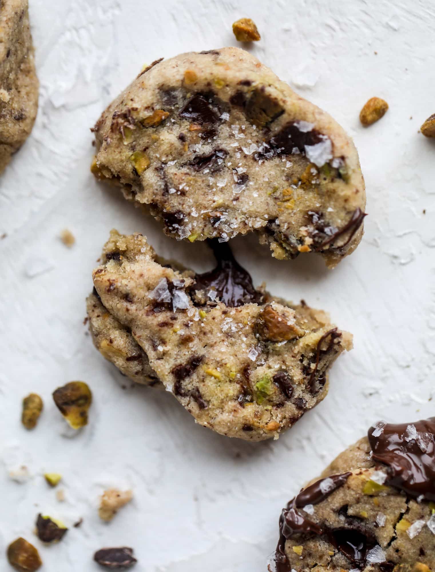 This chocolate pistachio shortbread recipe is the perfect combo of sweet and salty in a crunchy cookie! Melty, rich dark chocolate comes together with roasted, salted pistachios to make a delicious crunchy cookie! I howsweeteats.com #chocolate #pistachio #shortbread