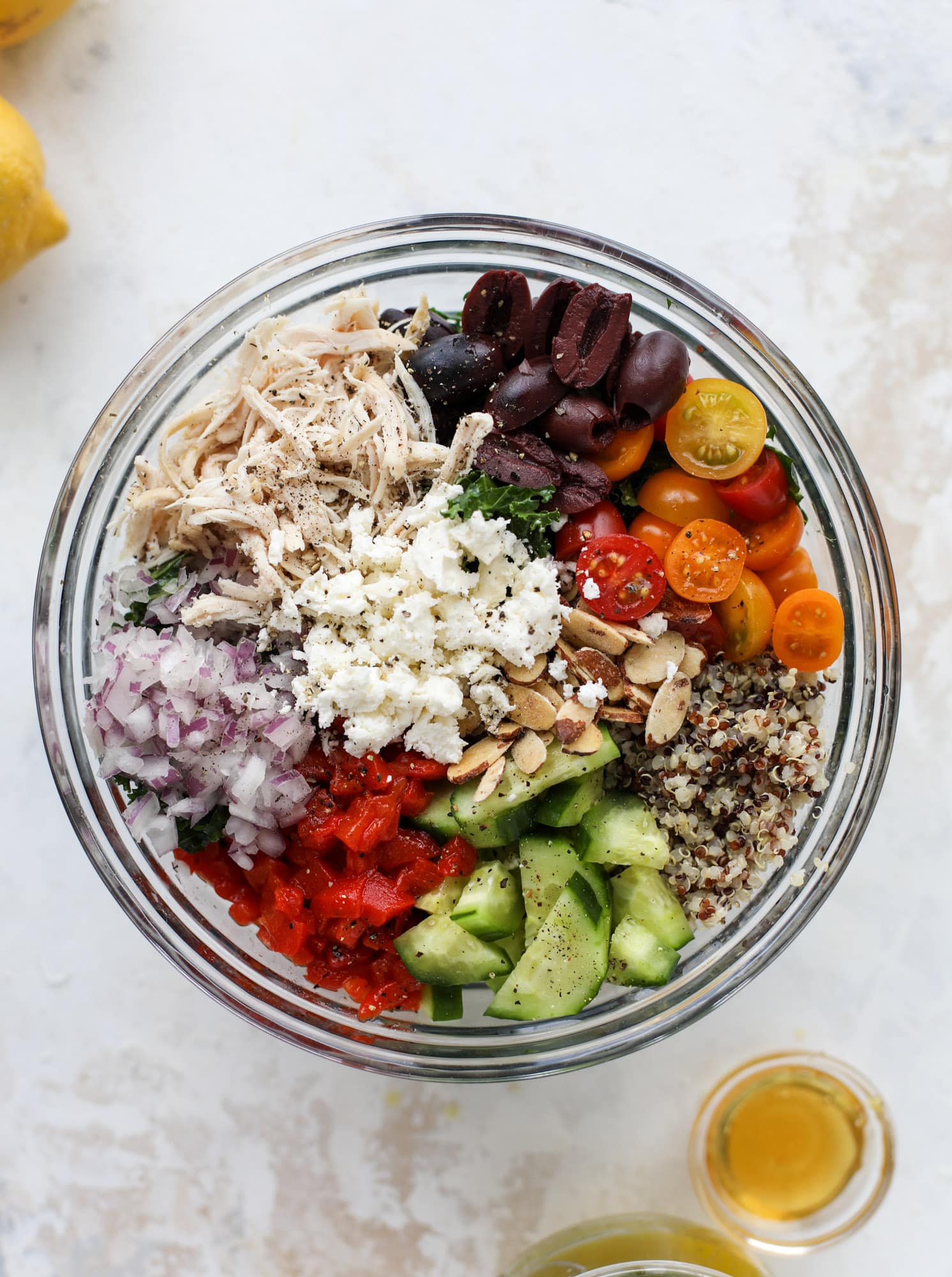This mediterranean kale and quinoa salad is a copycat for the delicious Panera Bread Modern Greek Salad with Chicken. Super easy and satisfying! I howsweeteats.com #mediterranean #kalesalad