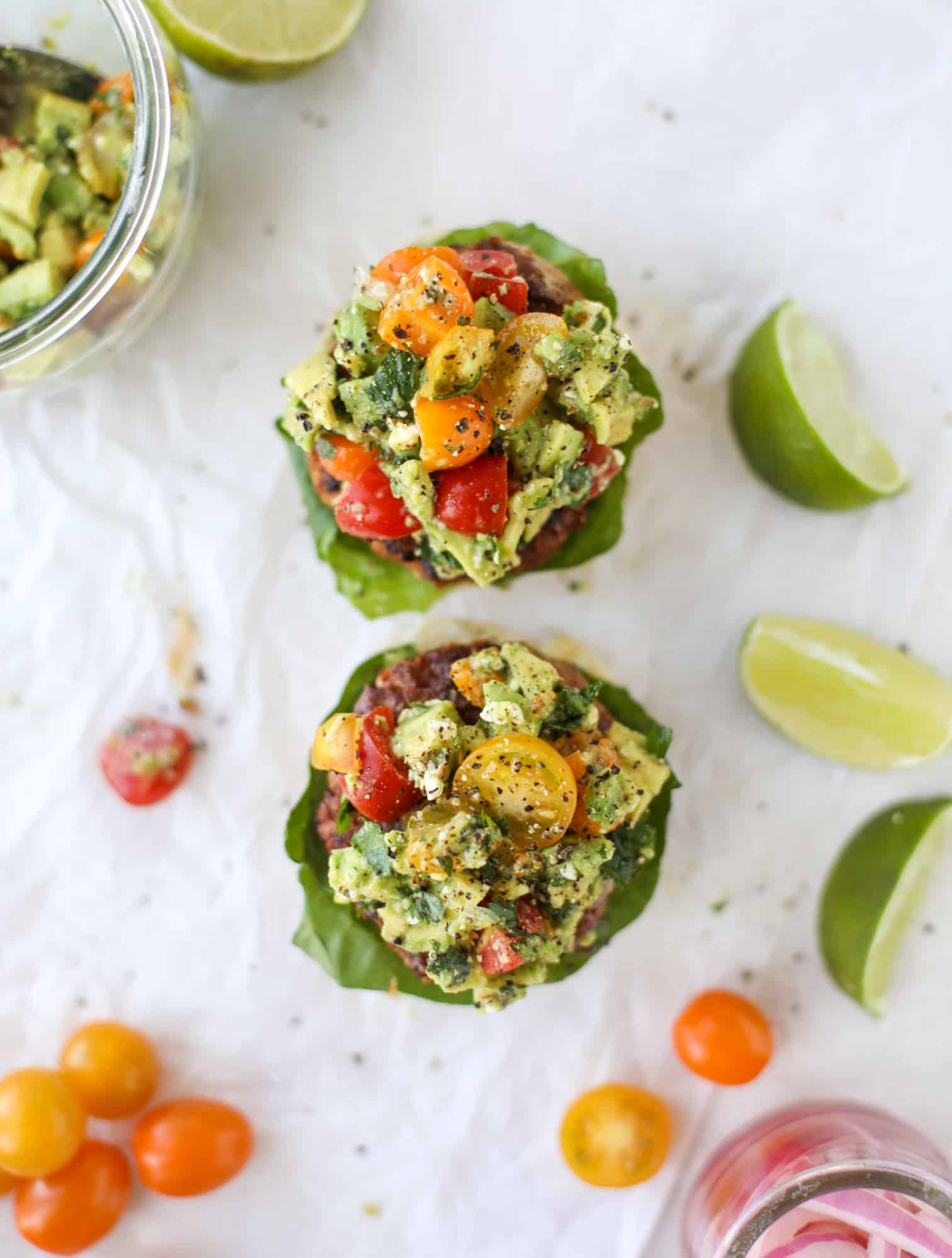 These turkey burgers are full of flavor and topped with a delicious chunky guacamole to take the flavor over the top. The perfect easy dinner! I howsweeteats.com #turkey #burgers