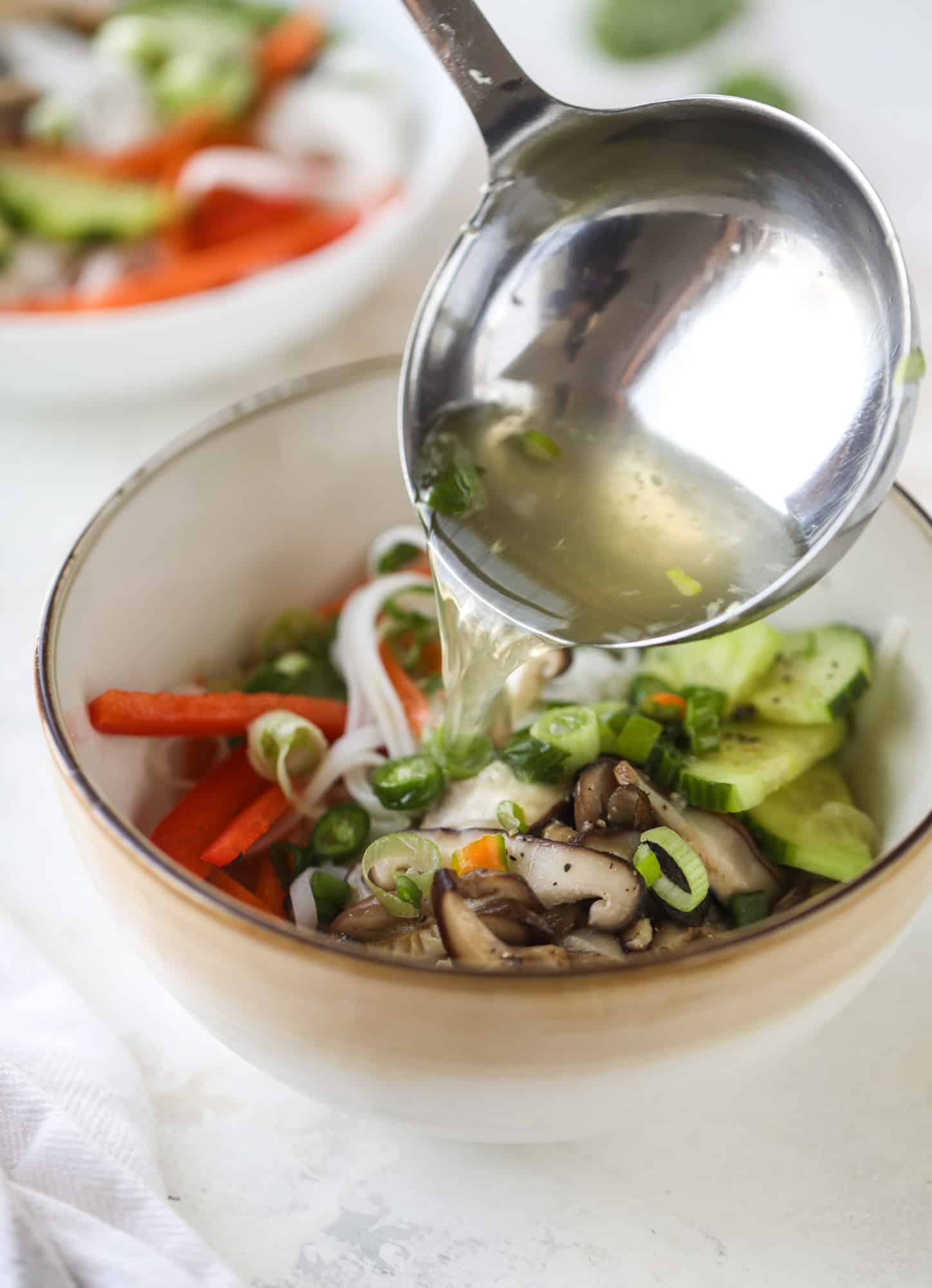 Ginger scallion noodle bowls are a flavorful, comforting vegetarian meal that can be customized to include any veggies you love! I howsweeteats.com #noodle #bowls