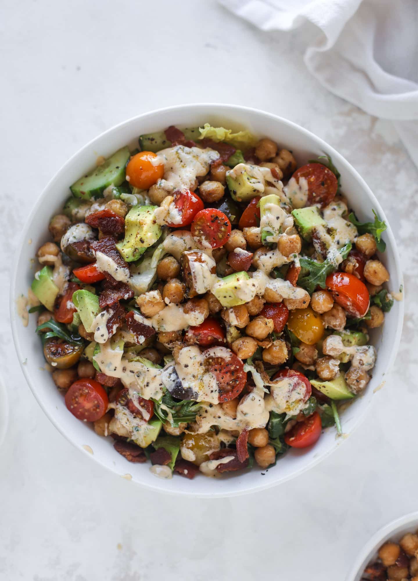 The chickpea bacon ranch salad has a ton of crispy, crunchy texture and flavor. It's satisfying and super easy to prep ahead of time too! I howsweeteats.com #chickpea #salad