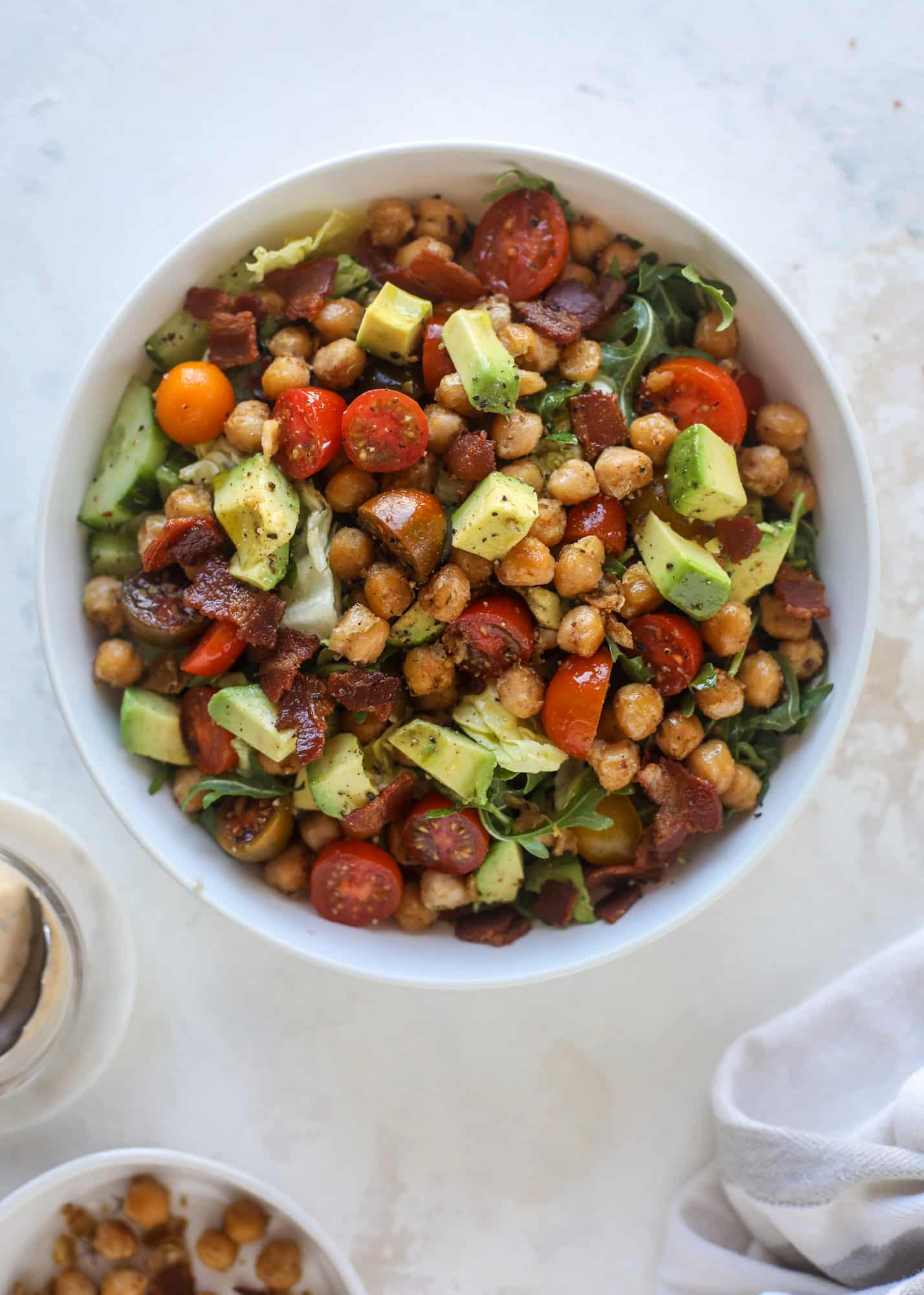 The chickpea bacon ranch salad has a ton of crispy, crunchy texture and flavor. It's satisfying and super easy to prep ahead of time too! I howsweeteats.com #chickpea #salad