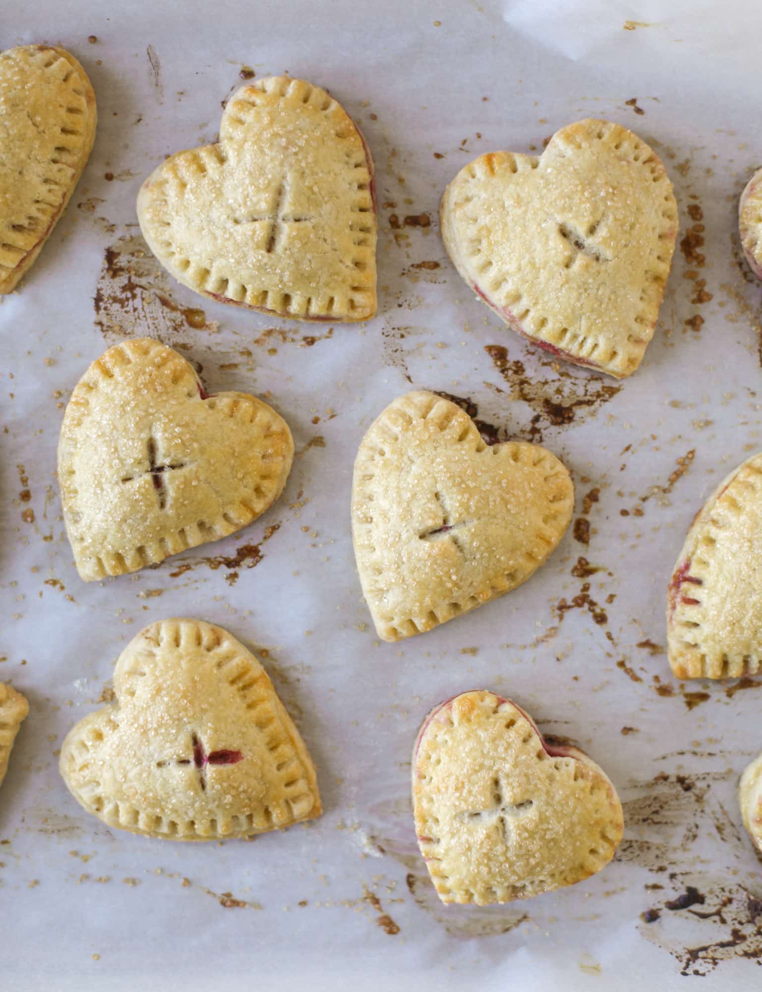 These adorable mini heart pies are filled with a homemade raspberry compote and creamy, chocolatey nutella. So fun and easy to make! I howsweeteats.com #heart #pie