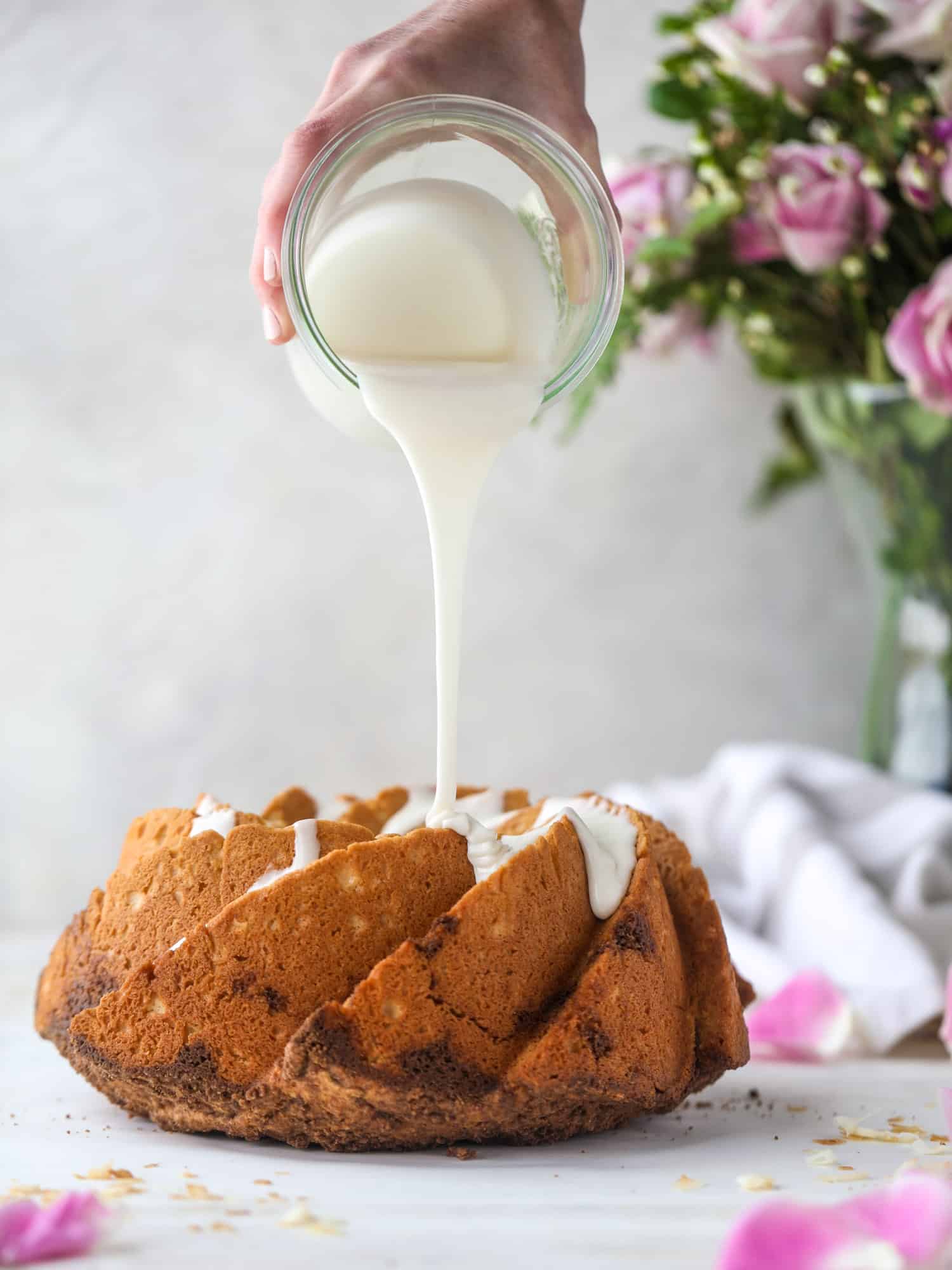 pouring glaze on coffee cake