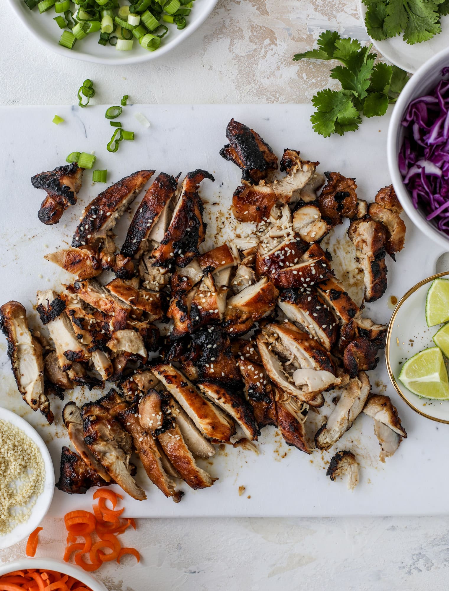 Korean chicken bowls are loaded with flavor: toasted sesame, soy sauce and lime come together over coconut rice and avocado to create a delicious meal! I howsweeteats.com #korean #chicken