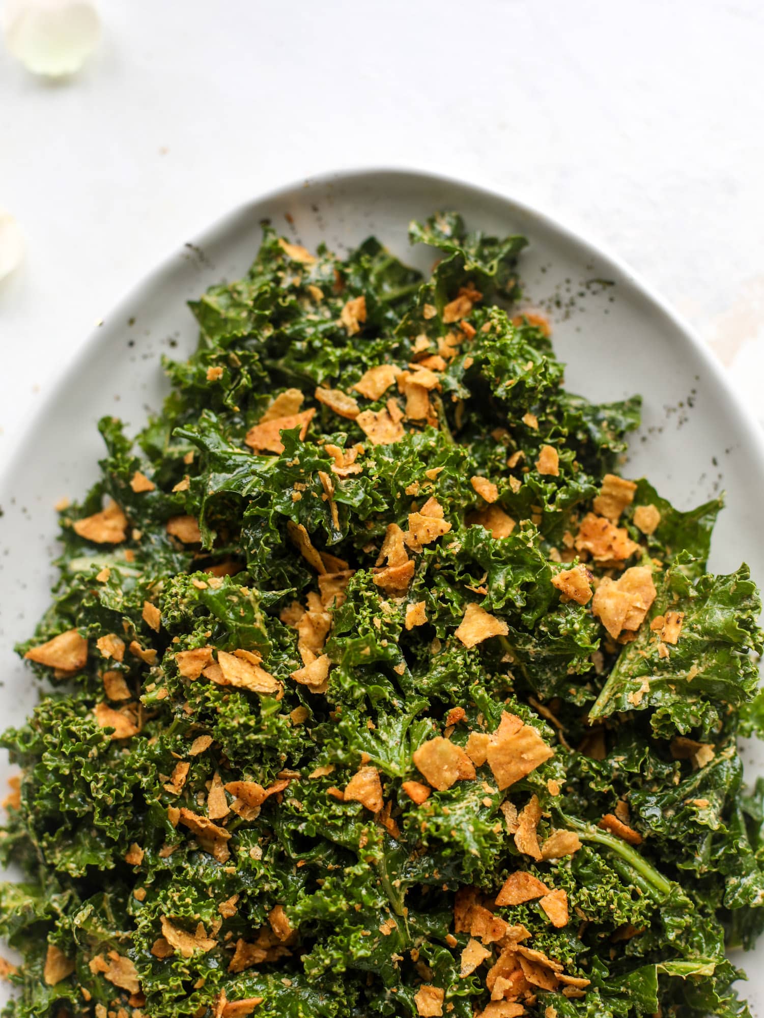 This cool ranch kale salad is loaded with all the flavor of our favorite chips. Simple enough to serve with almost everything, it's ridiculously flavorful!