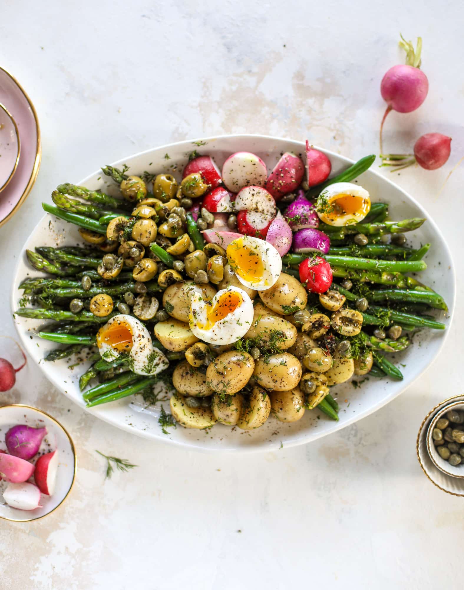 This spring version of the nicoise salad is loaded with crunchy green beans and asparagus, gorgeous radishes, tender potatoes and salty olives.