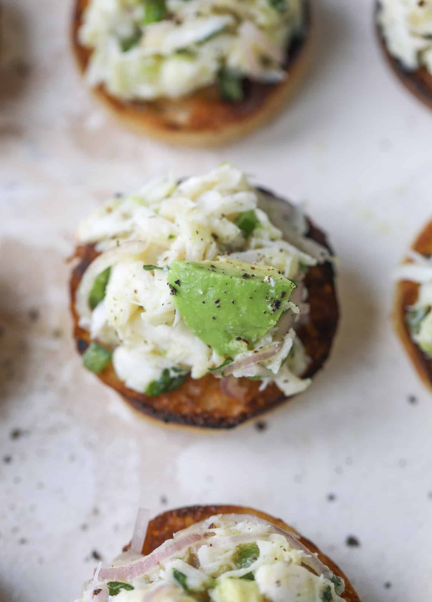 The cutest crab salad toasts are perfect for a snack, appetizer or light meal with a greens salad. This avocado crab salad is so refreshing and light!
