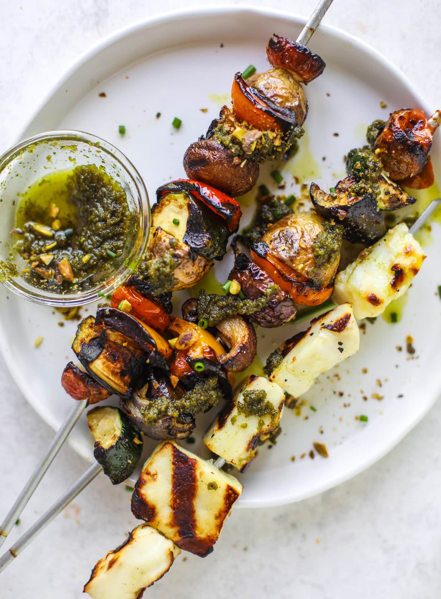 My all time favorite grilled vegetable skewers served with grilled halloumi cheese and pistachio pesto! Makes the best summer meal ever.