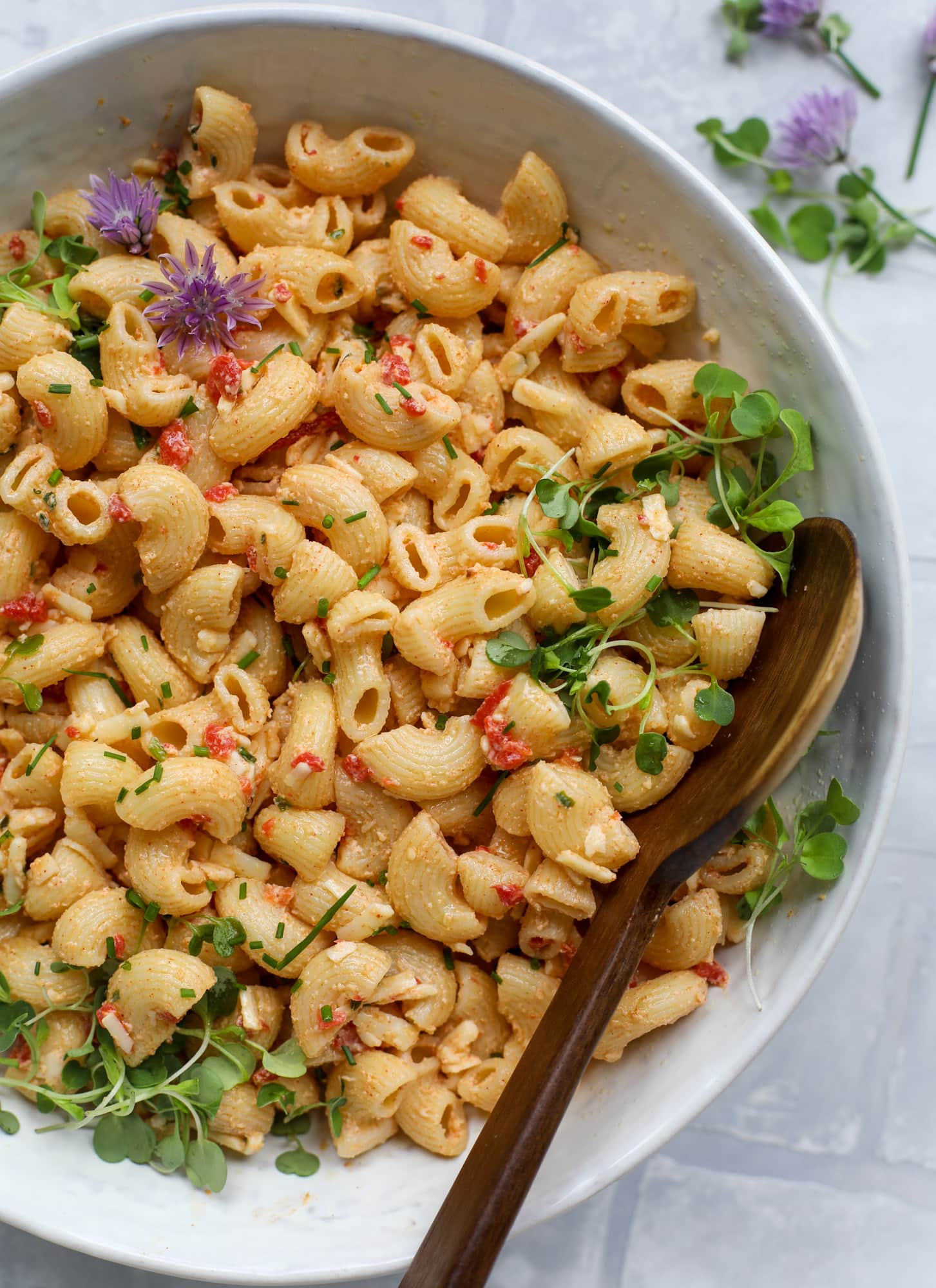 This pimento cheese pasta salad is the perfect summer side dish! All the flavor of pimento cheese and all the comforts of pasta salad, in one bowl!