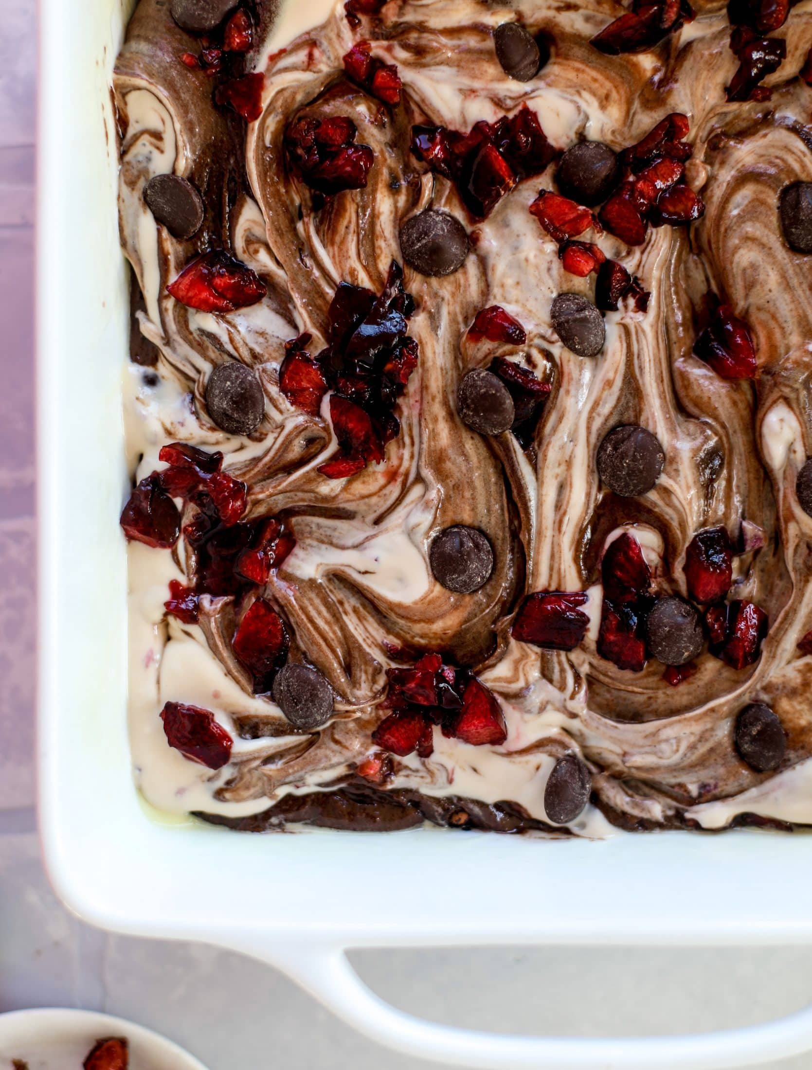These cherry cheesecake swirl brownies are super rich and fudgy, filled with dark chocolate and fresh cherry, topped with a cherry cheesecake swirl.
