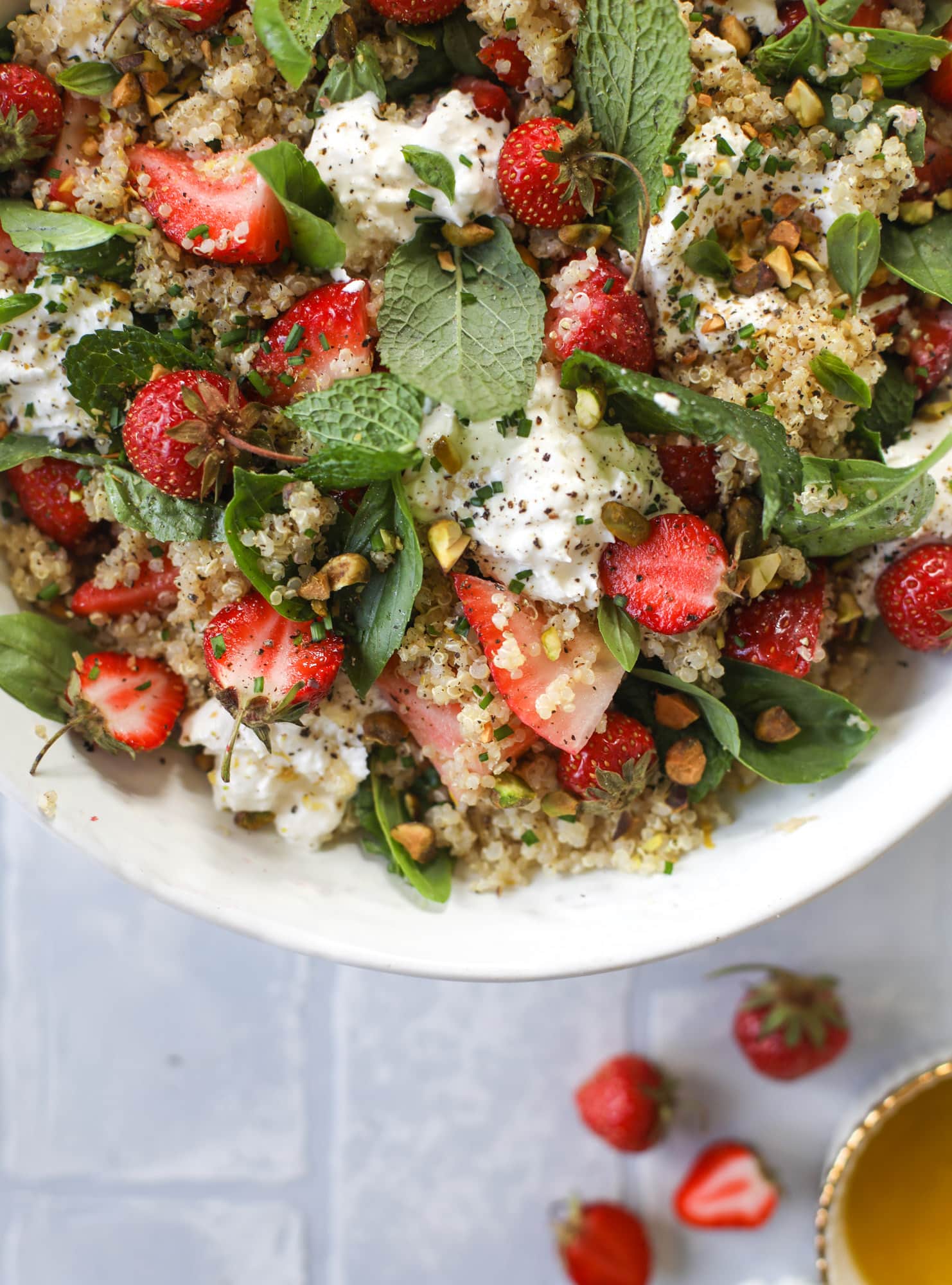This strawberry quinoa salad is loaded with fresh herbs, burrata cheese and chopped pistachios. Topped with a lemon dressing, it's heavenly!