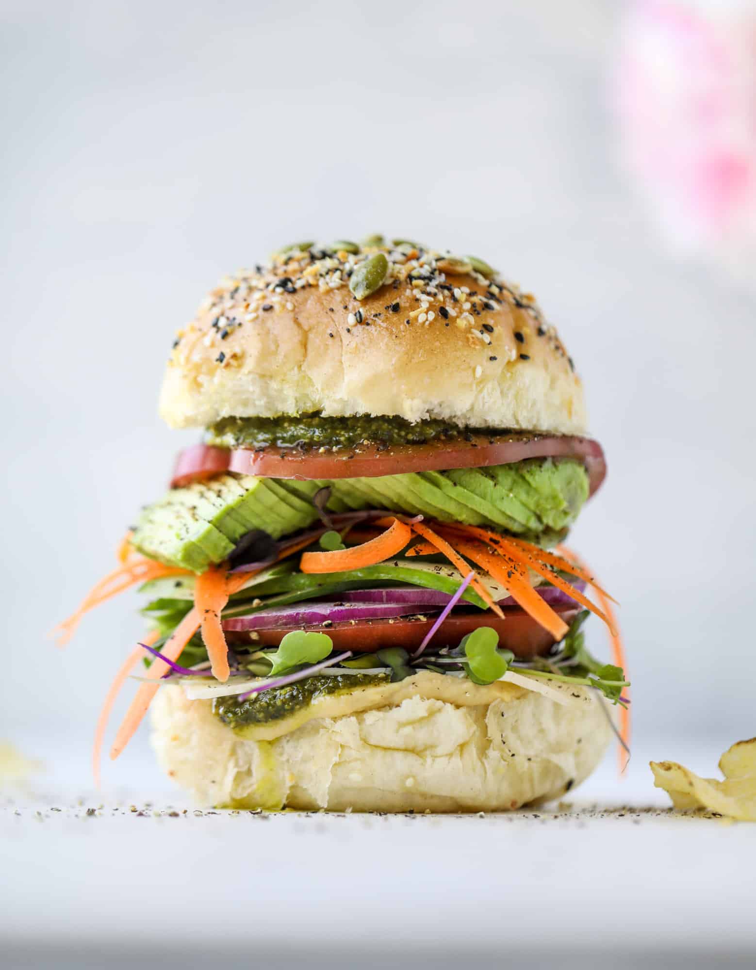 This summer veggie sandwich is full of creamy hummus, fresh pesto and havarti cheese along with tons of sliced, fresh vegetables. Best lunch ever!