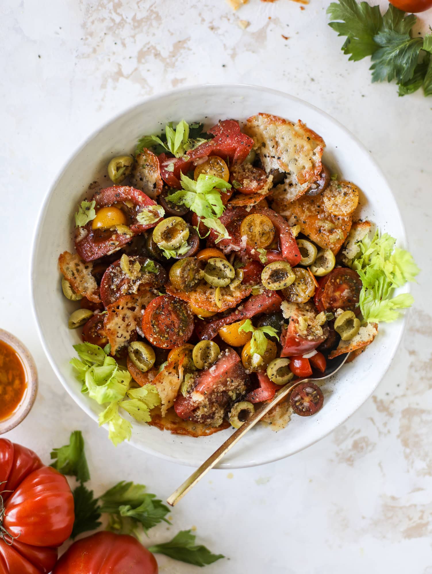This bloody mary tomato salad has all the incredible flavor of the bloody mary cocktail! Topped with cheddar crisps, it's delicious! 