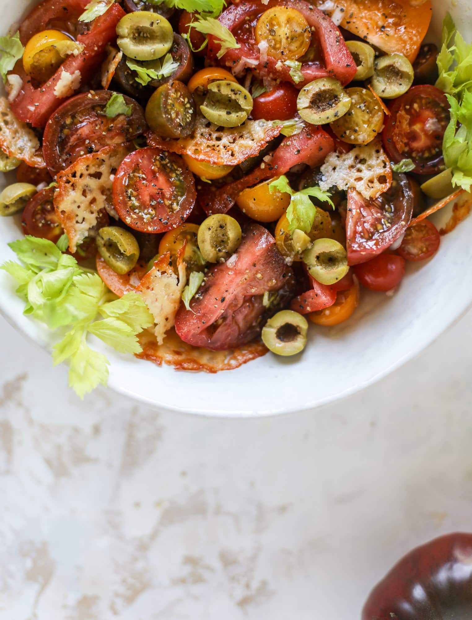 This bloody mary tomato salad has all the incredible flavor of the bloody mary cocktail! Topped with cheddar crisps, it's delicious! 