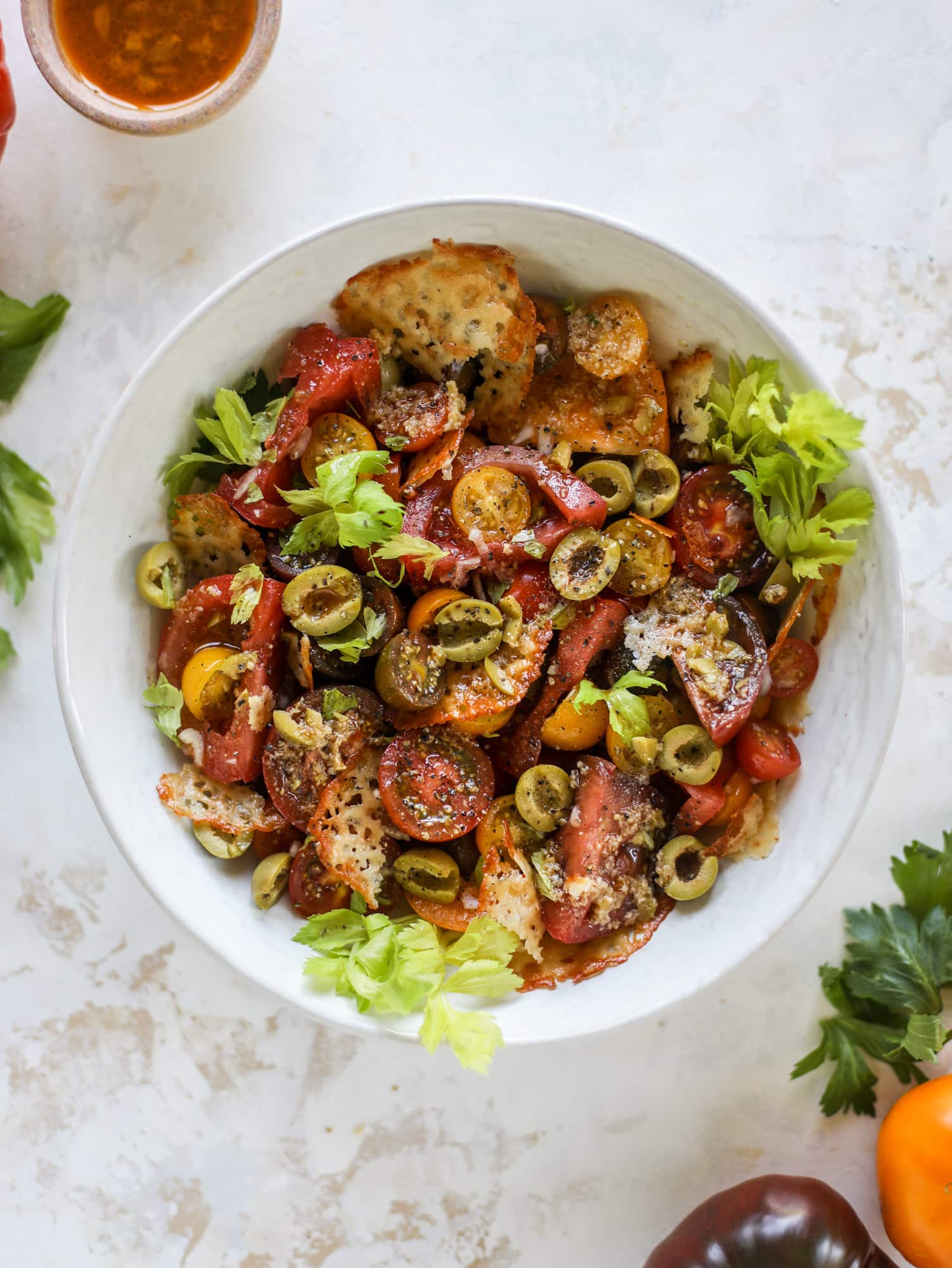 This bloody mary tomato salad has all the incredible flavor of the bloody mary cocktail! Topped with cheddar crisps, it's delicious! 