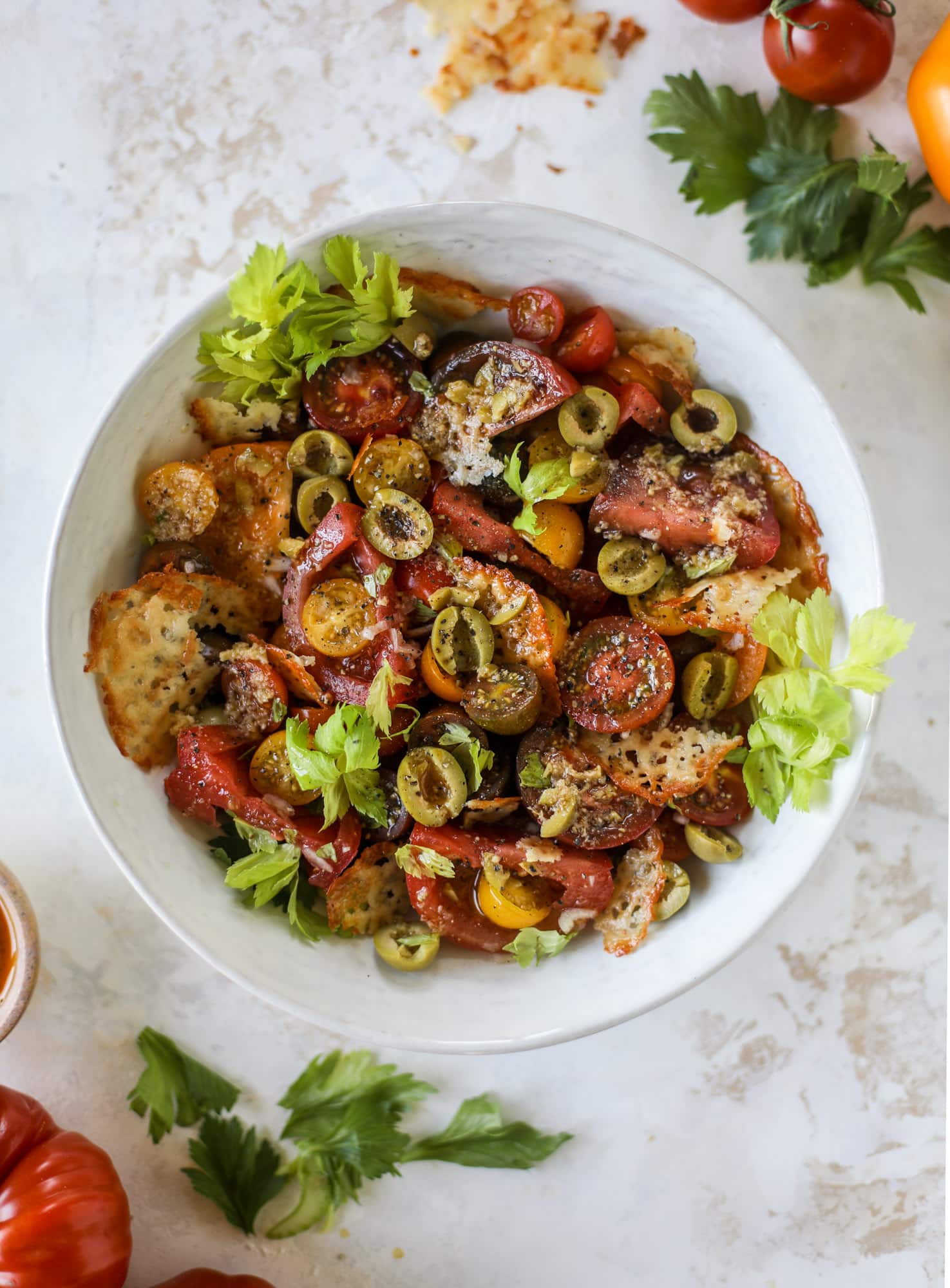 This bloody mary tomato salad has all the incredible flavor of the bloody mary cocktail! Topped with cheddar crisps, it's delicious! 