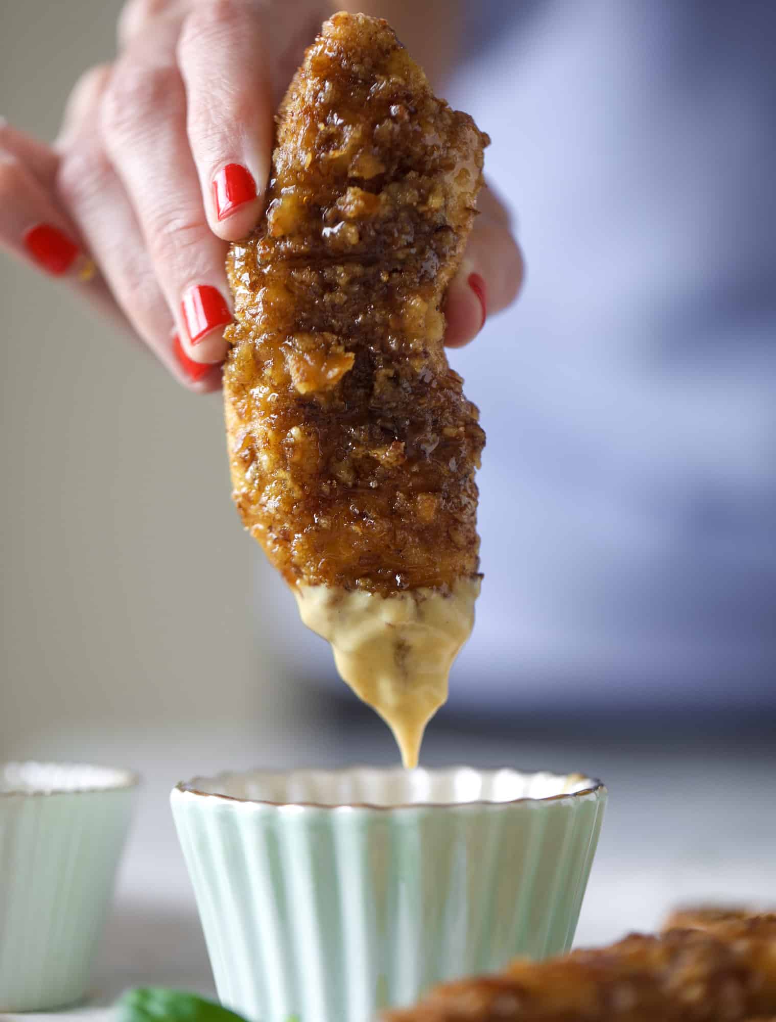 These pretzel crusted chicken fingers are baked, crunchy and ridiculously flavorful. Drizzle with hot honey and dip in house sauce. Yum!