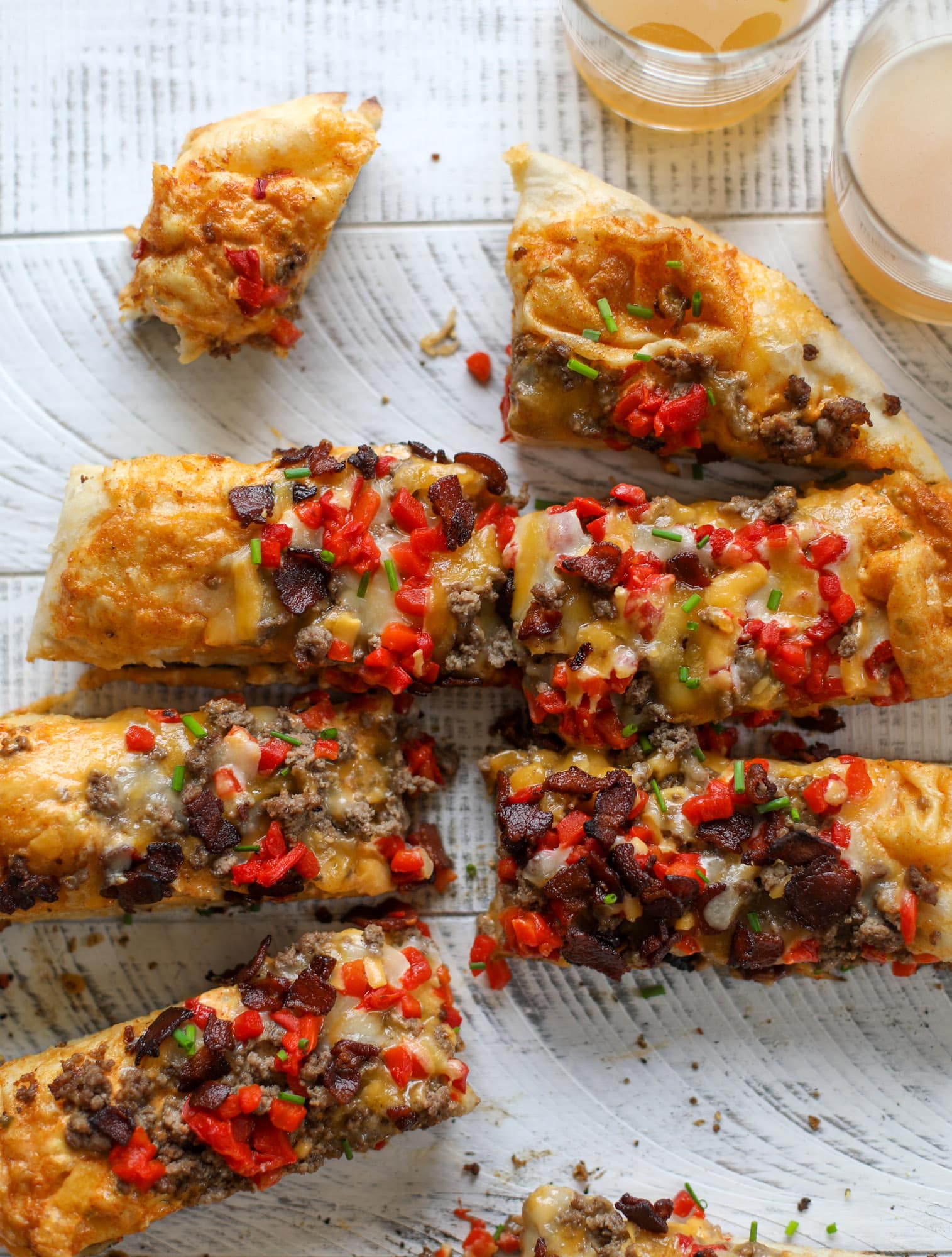 This grilled cheeseburger pizza is my take on the smoke shack burger! Cheddar, bacon, cherry peppers and special sauce make this impossible to resist.