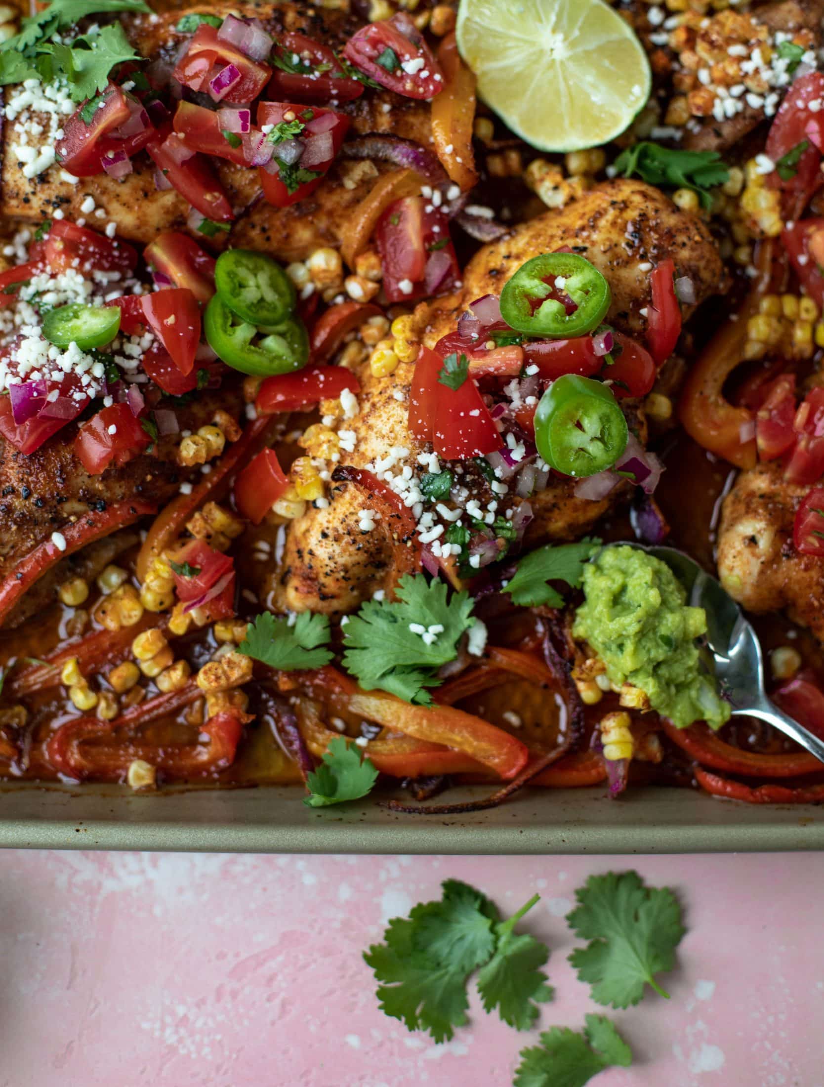 This sheet pan nacho chicken recipe results in the juiciest, more flavorful chicken that can be served in a multitude of ways!