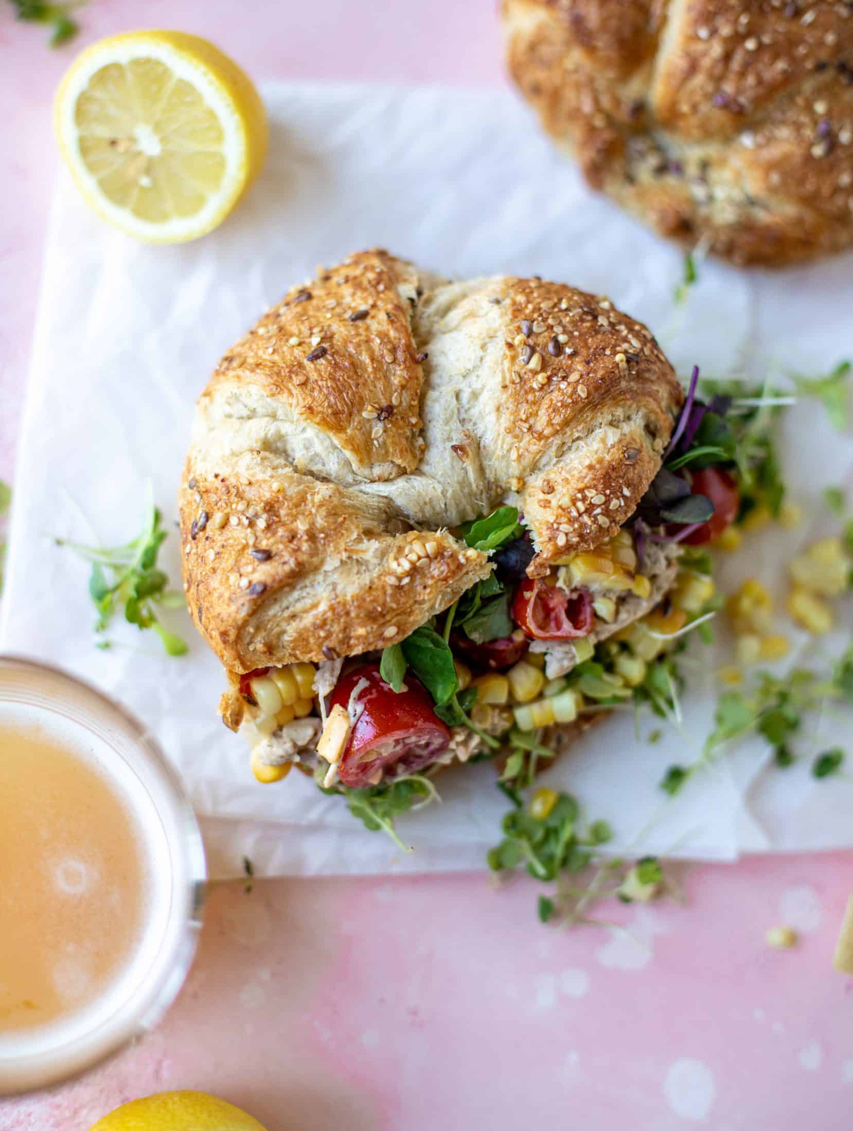 This smoky summer chicken salad is incredible! So much flavor from grilled chicken, sweet cherry tomatoes, corn, cheddar cheese and a secret ingredient!