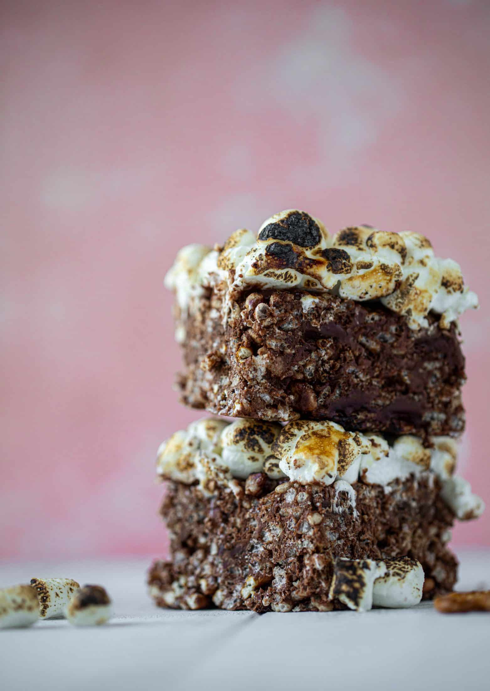 These indulgent s'mores bars are crispy and crunchy and studded with salted pretzels! Toasted marshmallow and dark chocolate make these the best treat ever!