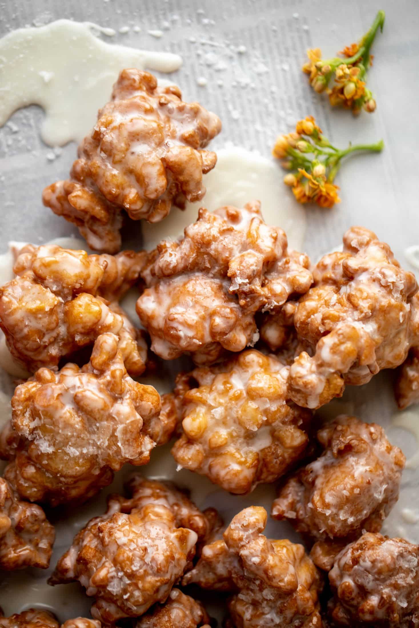 These salted apple fritters use honeycrisp apples and flaked sea salt for a fall flavor explosion. These are the best treat ever!