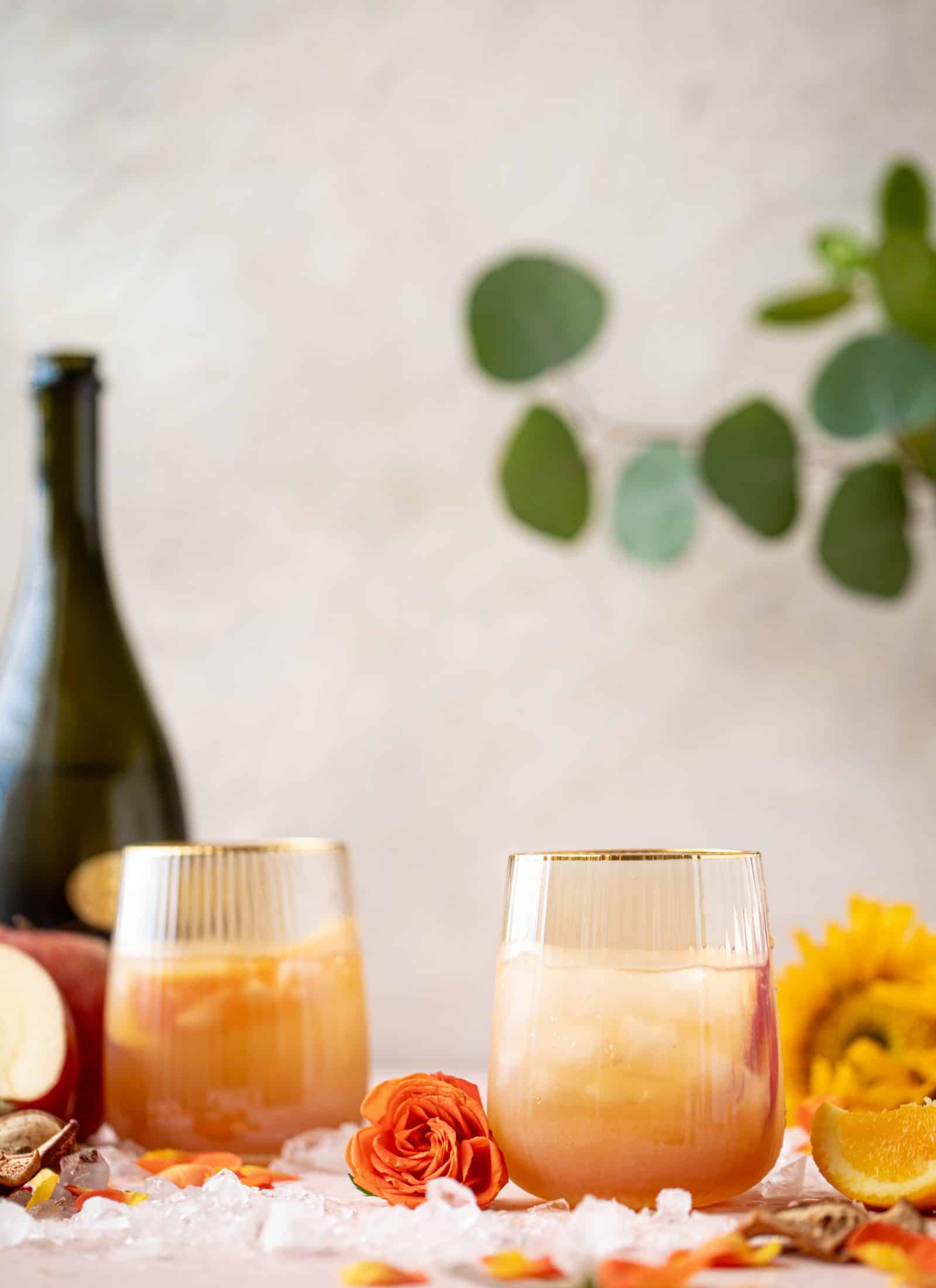 This apple cider spritz is an autumnal take on the classic aperol spritz. Apple cider, prosecco and aperol come together in this refreshing cocktail! 