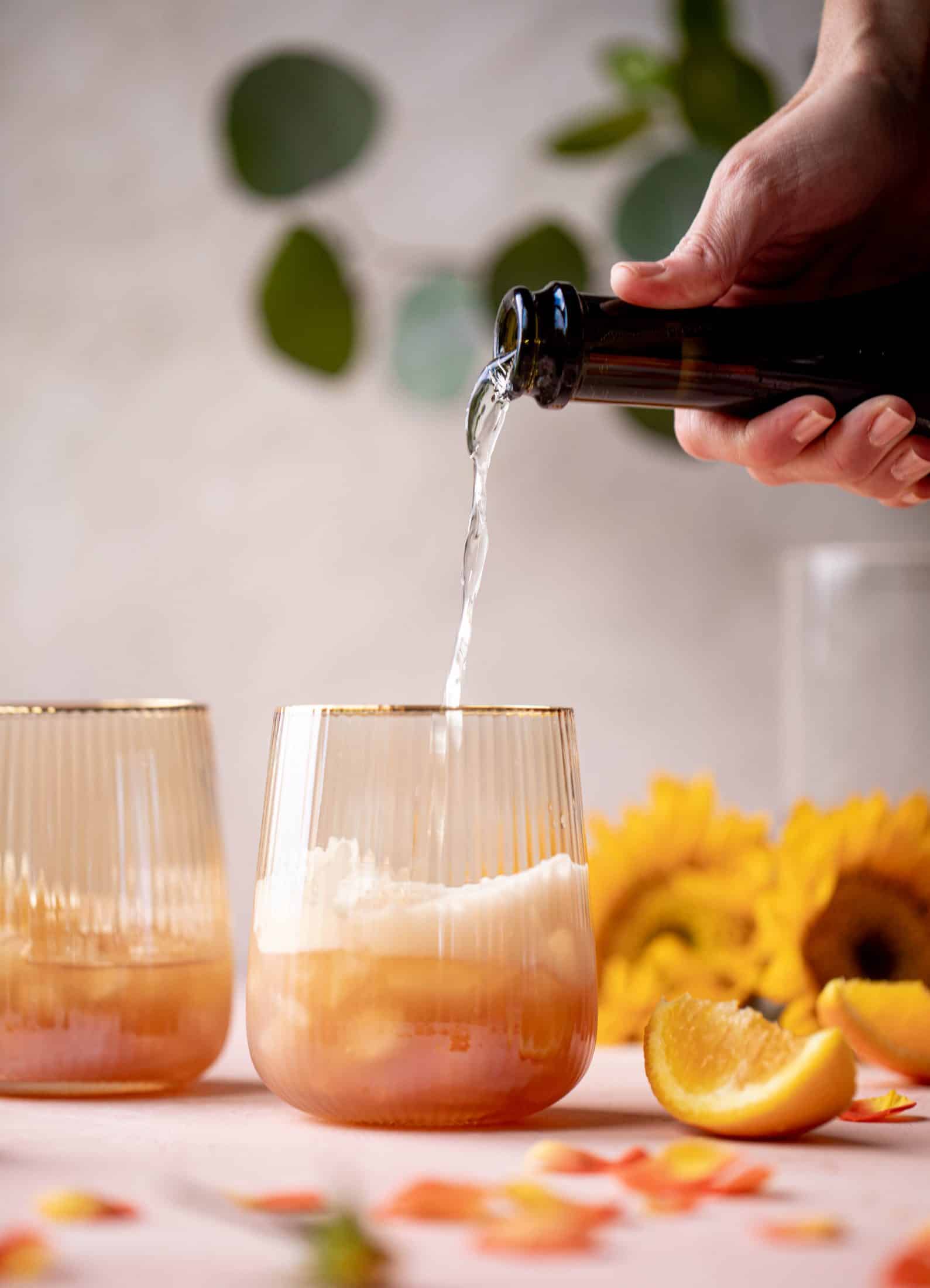 This apple cider spritz is an autumnal take on the classic aperol spritz. Apple cider, prosecco and aperol come together in this refreshing cocktail! 
