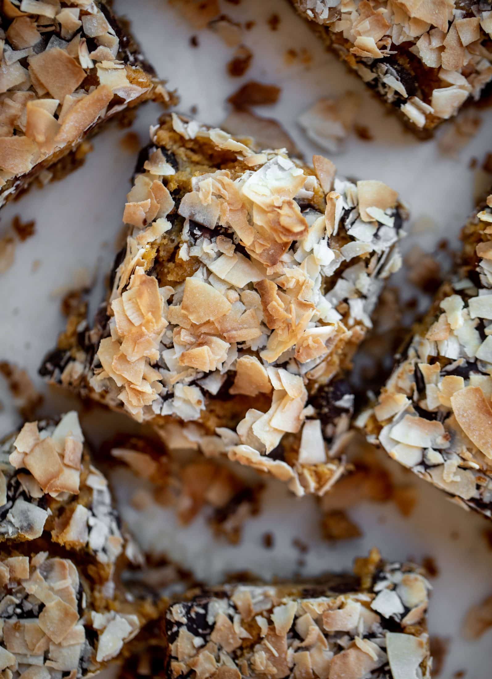 Pumpkin gooey bars are a decadent chocolate, coconut and pumpkin dessert! Crunchy graham crust, gooey pumpkin center and a crisp topping. Yum!