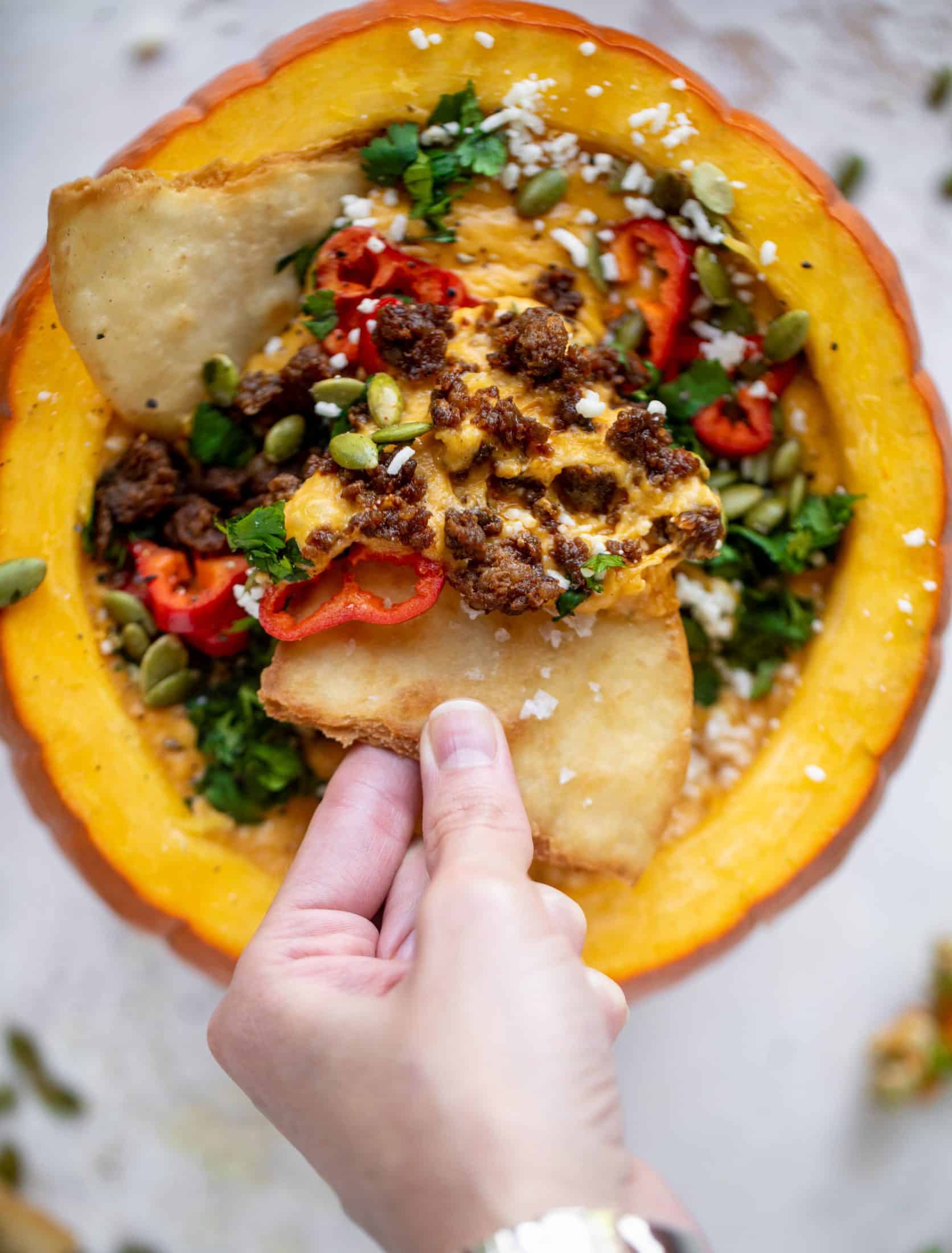 This pumpkin queso fundido is the perfect indulgence for fall. Warm pumpkin queso topped with chroizo, pepitas and jalapeños. It's delish! 