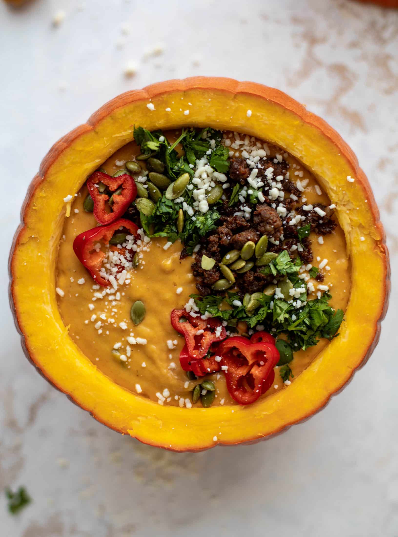 This pumpkin queso fundido is the perfect indulgence for fall. Warm pumpkin queso topped with chroizo, pepitas and jalapeños. It's delish! 