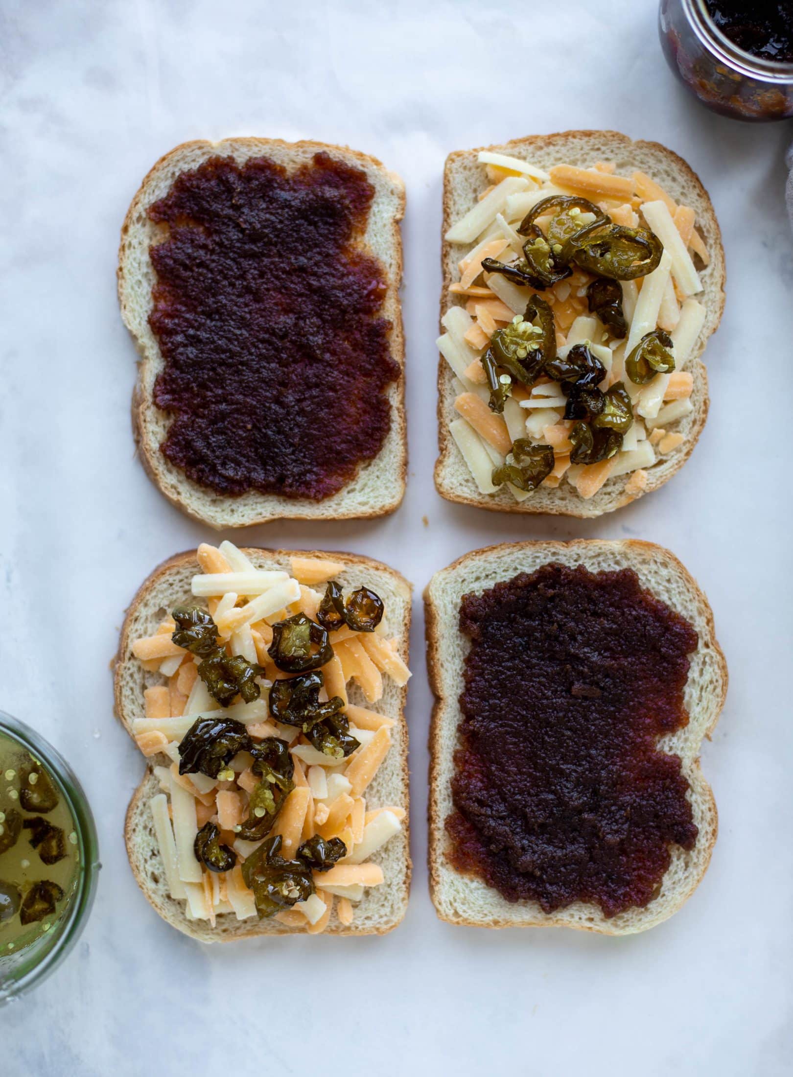 This bacon grilled cheese is filled with sharp cheddar and candied jalapeños! Served alongside a soup dipped for the ultimate comforting meal. 