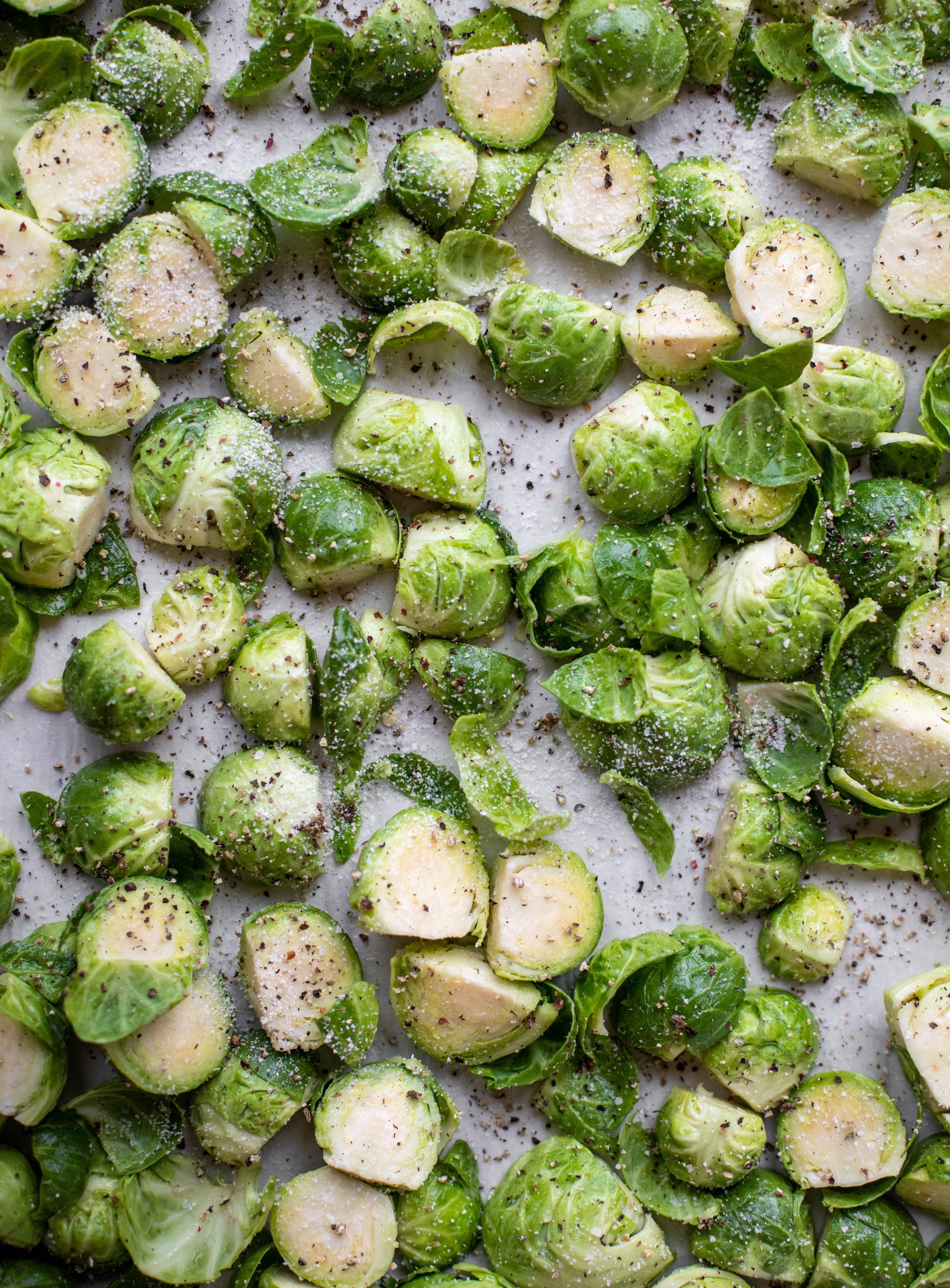 This cacio e pepe brussels are out of the world. Roasted until crisp, topped with tons of black pepper and salty pecorino cheese. Yum.