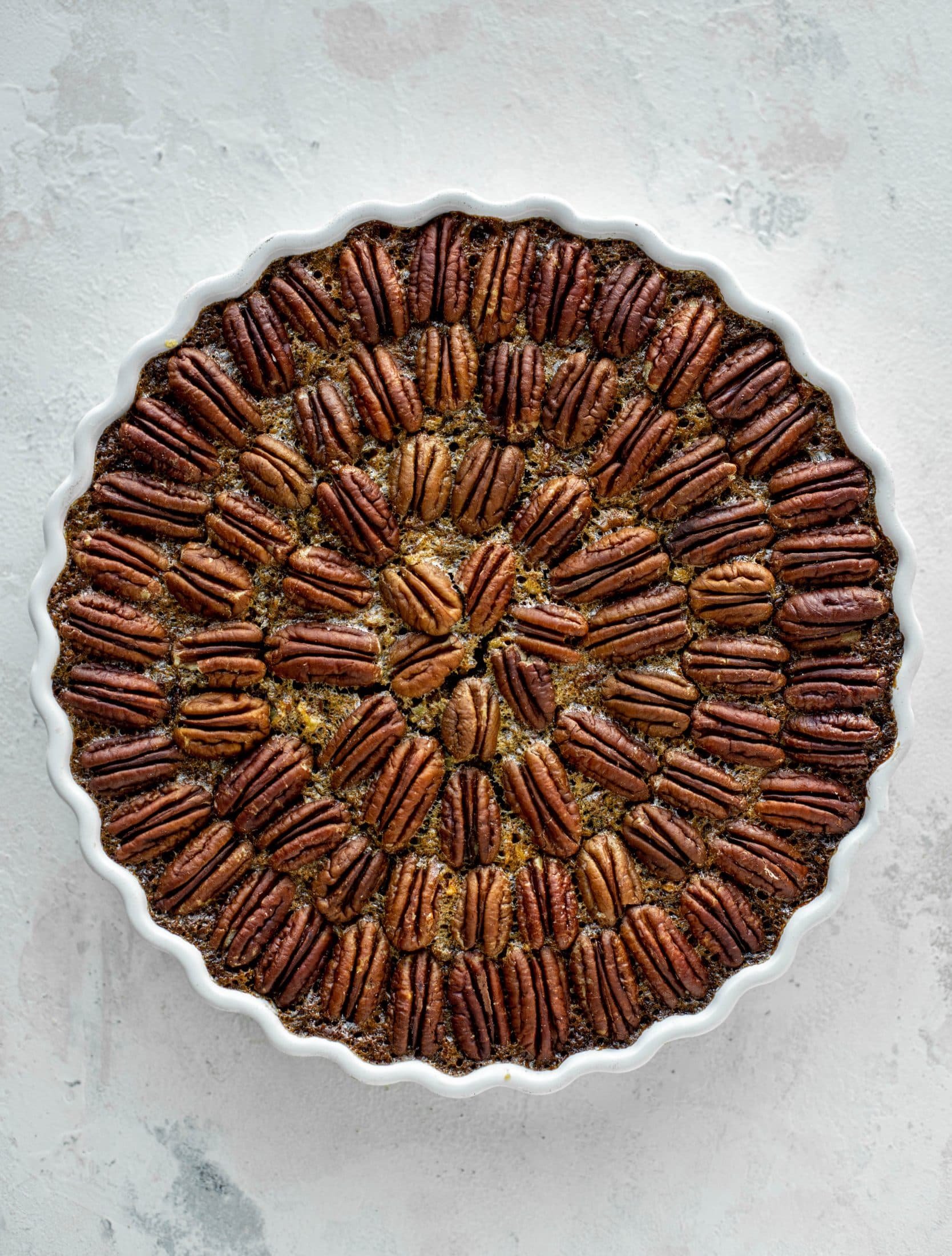 This chocolate pecan tart is the best dessert ever. Chocolate fudge and gooey pecan pie in a shortbread crust - everyone goes crazy! 