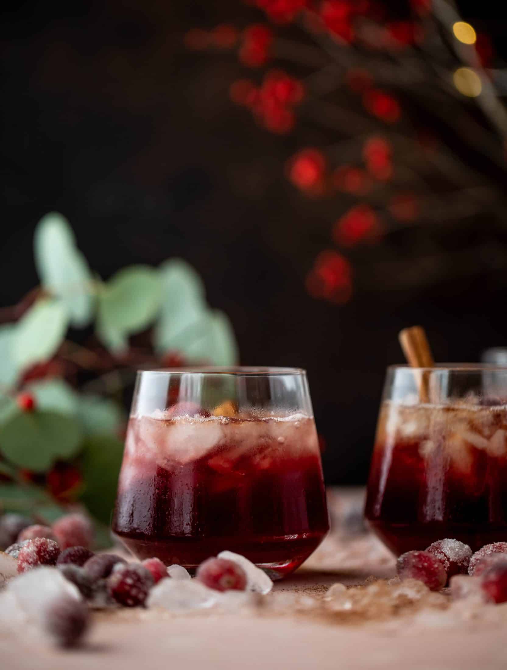 This cranberry cobbler smash is perfect for the holiday season! Bourbon, cinnamon simple syrup and cranberry juice - it's spiced and warming and wonderful.