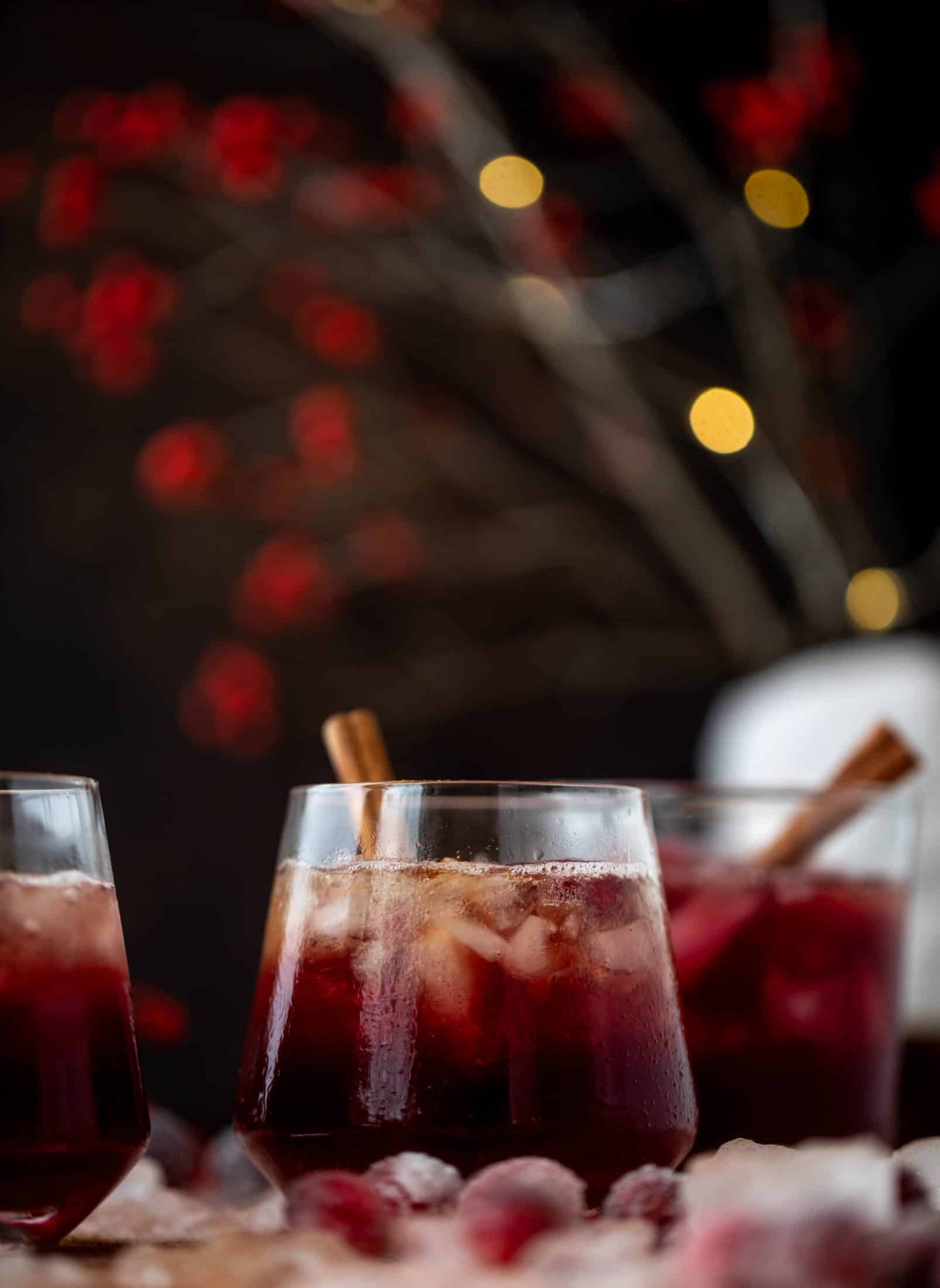This cranberry cobbler smash is perfect for the holiday season! Bourbon, cinnamon simple syrup and cranberry juice - it's spiced and warming and wonderful.