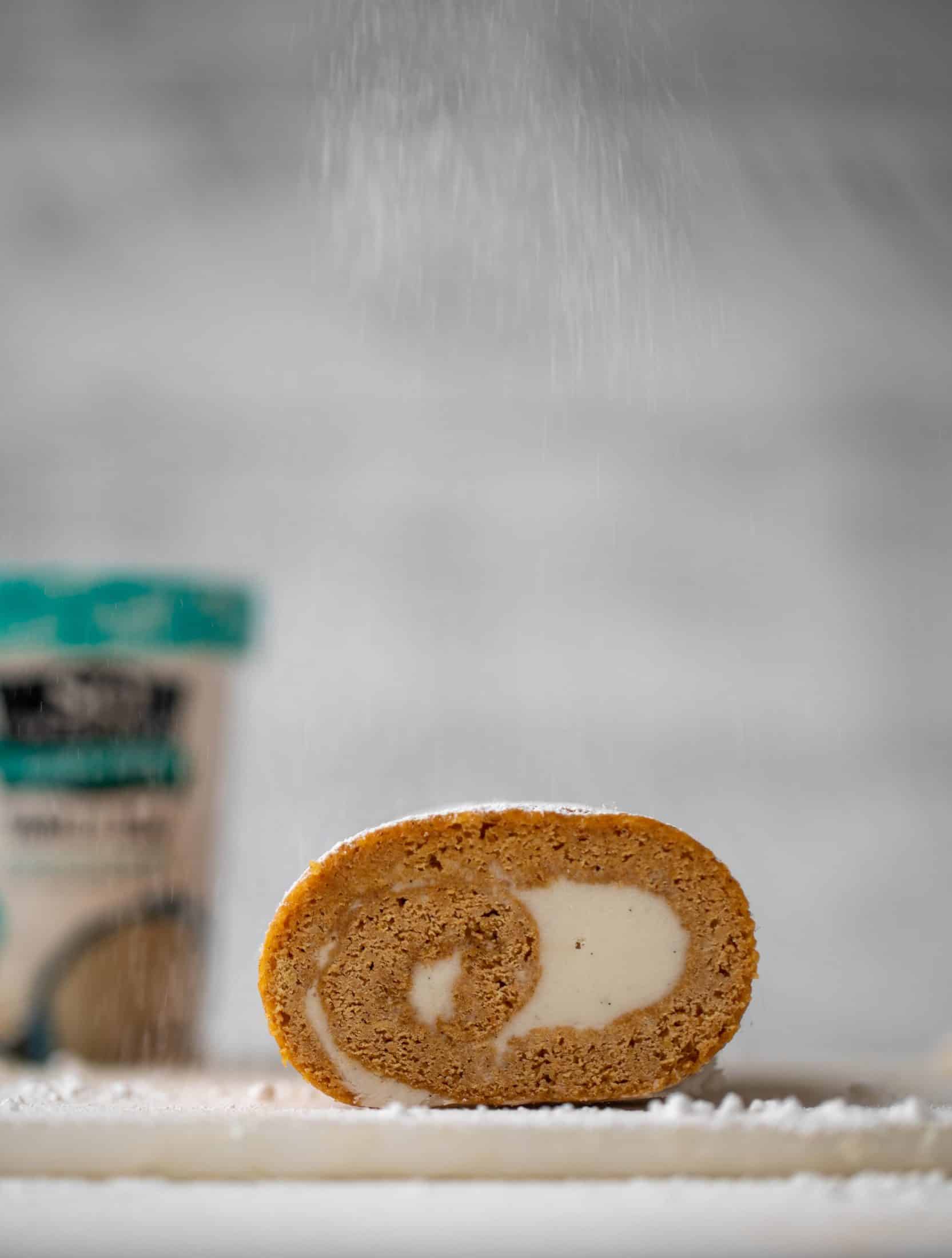 This frozen pumpkin roll is a delicious twist on the classic! Ice cream or non-dairy dessert is spread inside a classic pumpkin roll and serve frozen!