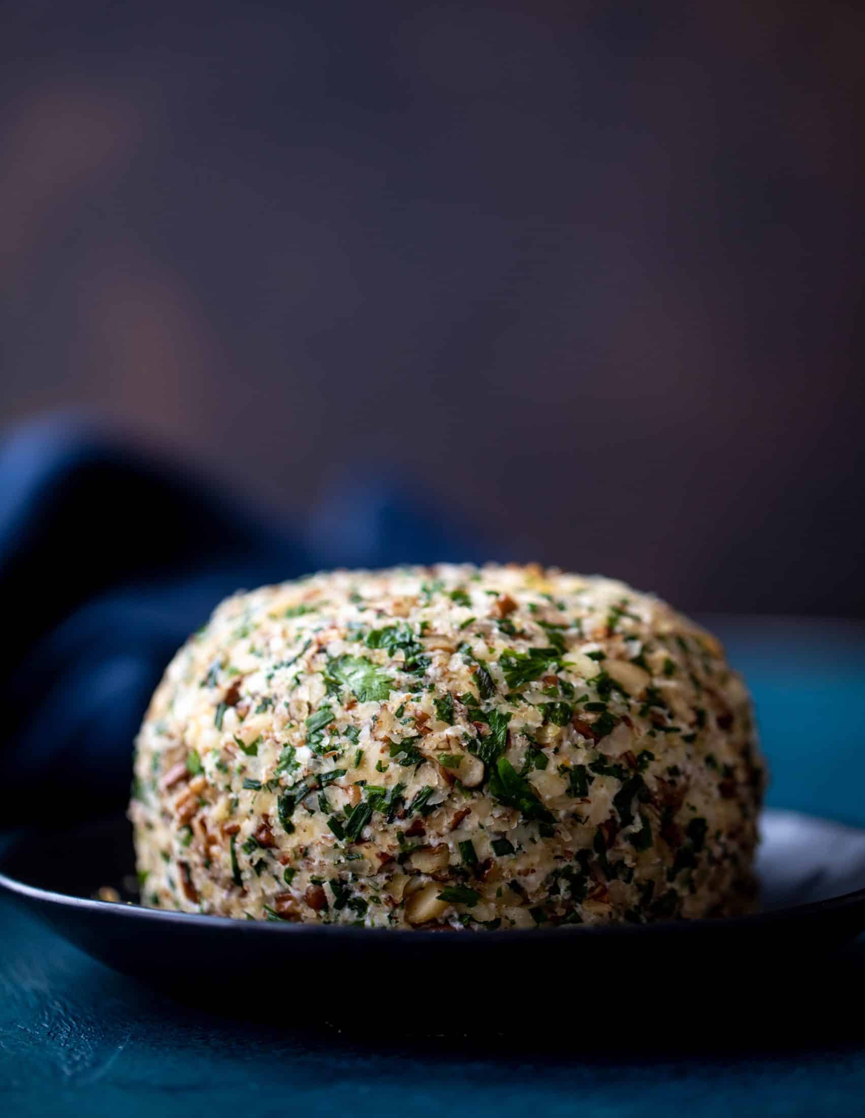 This macadamia nut cheeseball is flavored with fresh orange, spices, crispy sage and pecorino cheese. It's the perfect make-ahead snack!