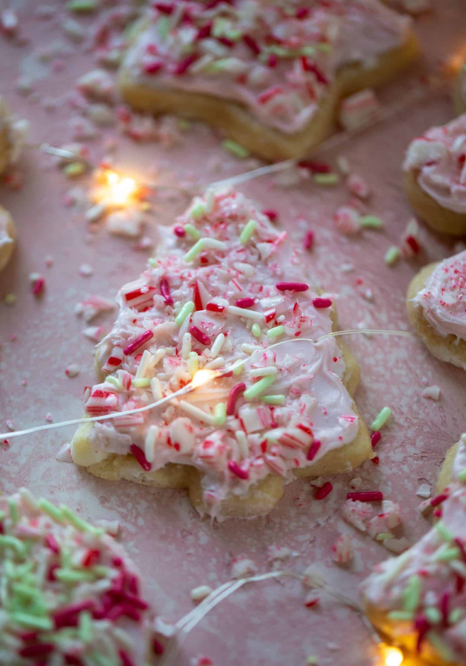 Pink peppermint sugar cookies are classic vanilla cut out cookies topped with peppermint cream cheese frosting. They are delicious! 