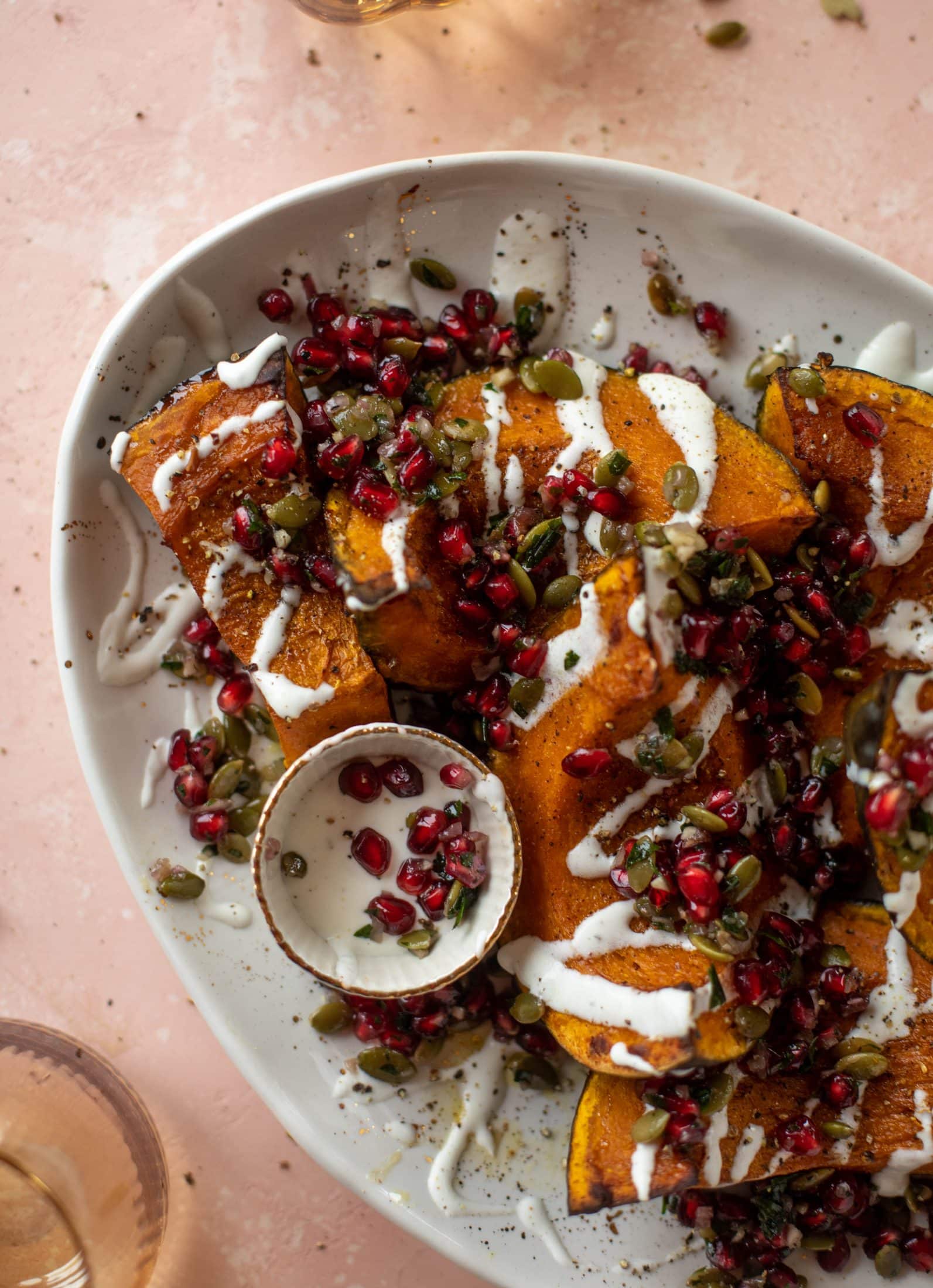 This roasted kabocha squash is caramely and naturally sweet, drizzled with whipped goat cheese and topped with pomegranate pepita relish. It's unreal!